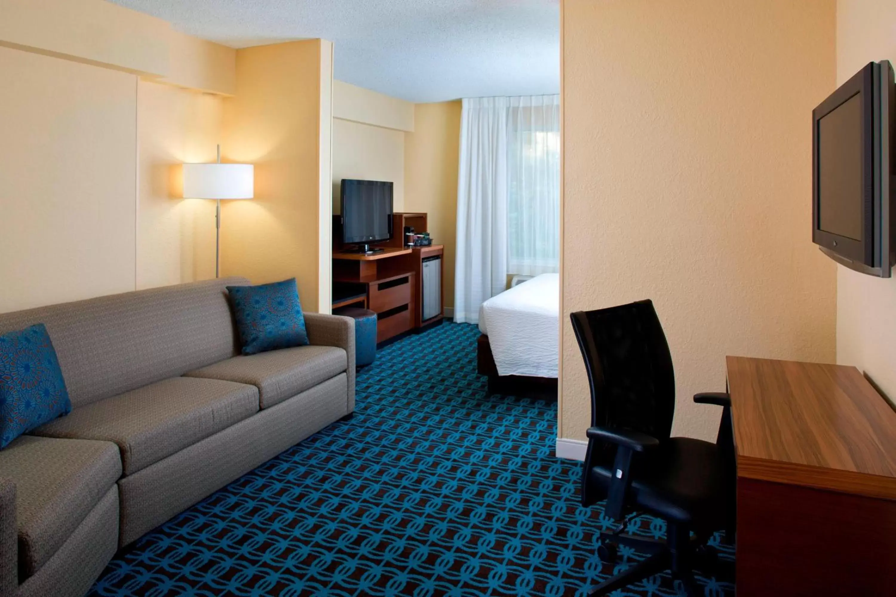 Photo of the whole room, Seating Area in Fairfield Inn & Suites by Marriott Orlando Lake Buena Vista in the Marriott Village