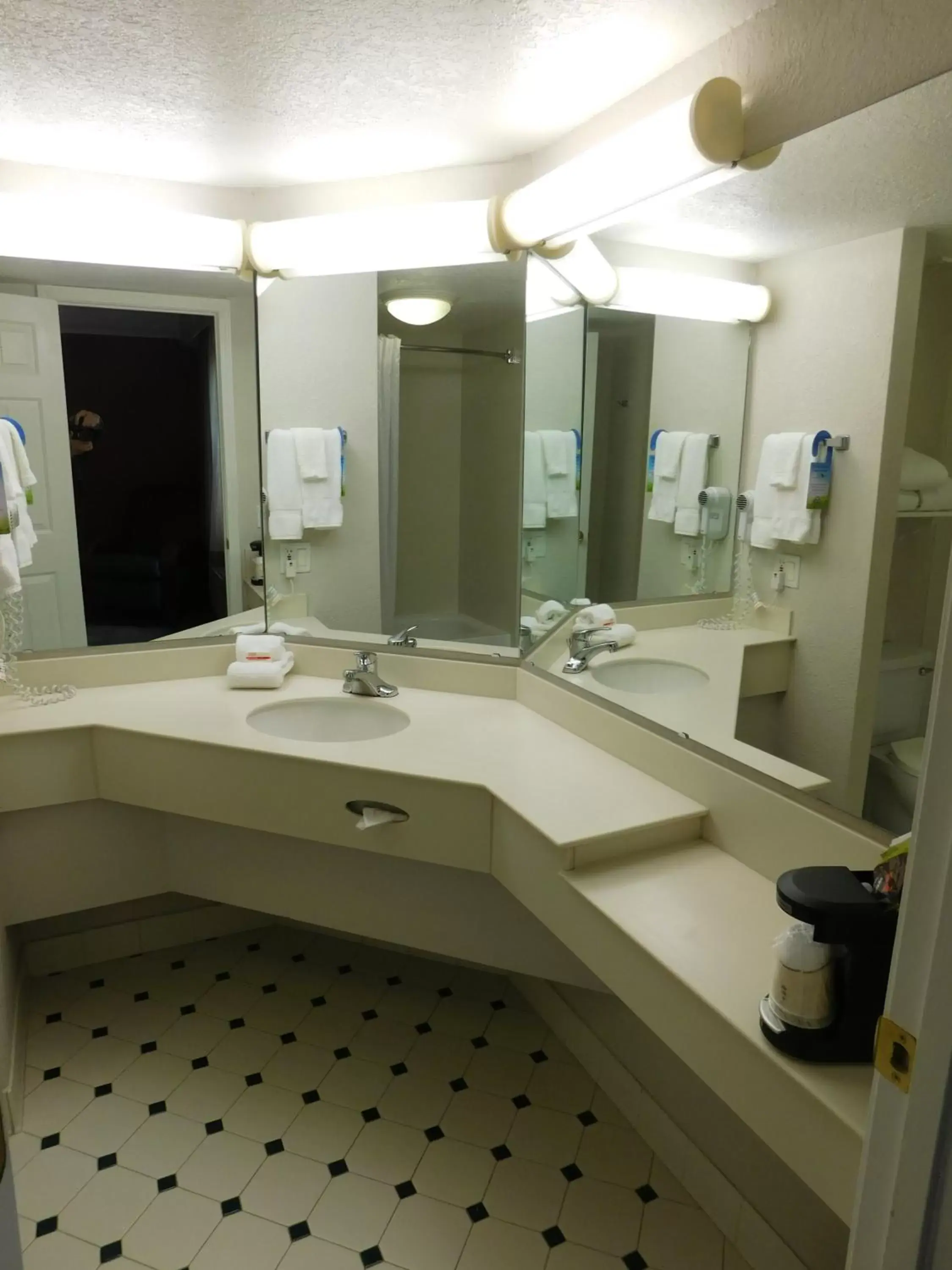 Bathroom in Days Inn & Suites by Wyndham Schaumburg- Woodfield Mall