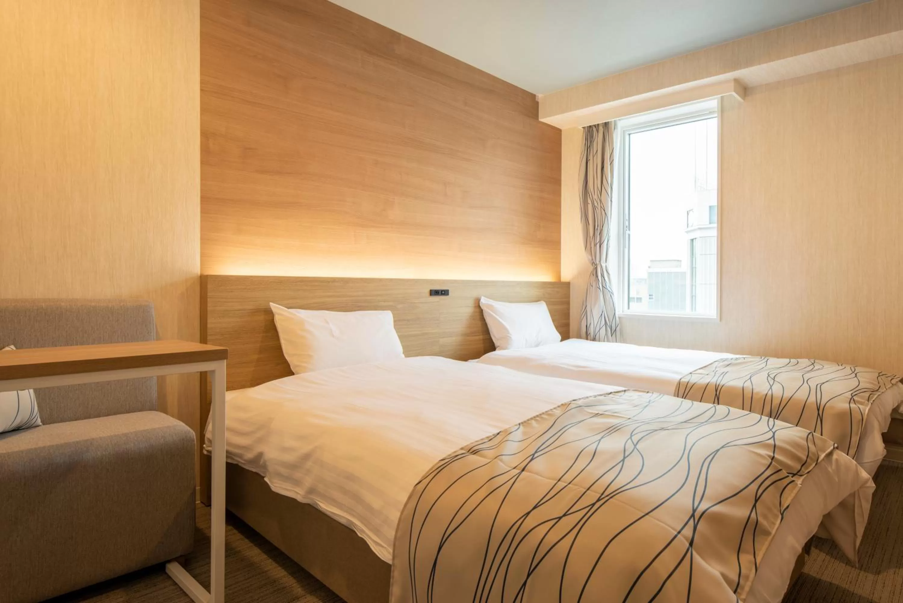 Bed in HOTEL AMANEK Asahikawa