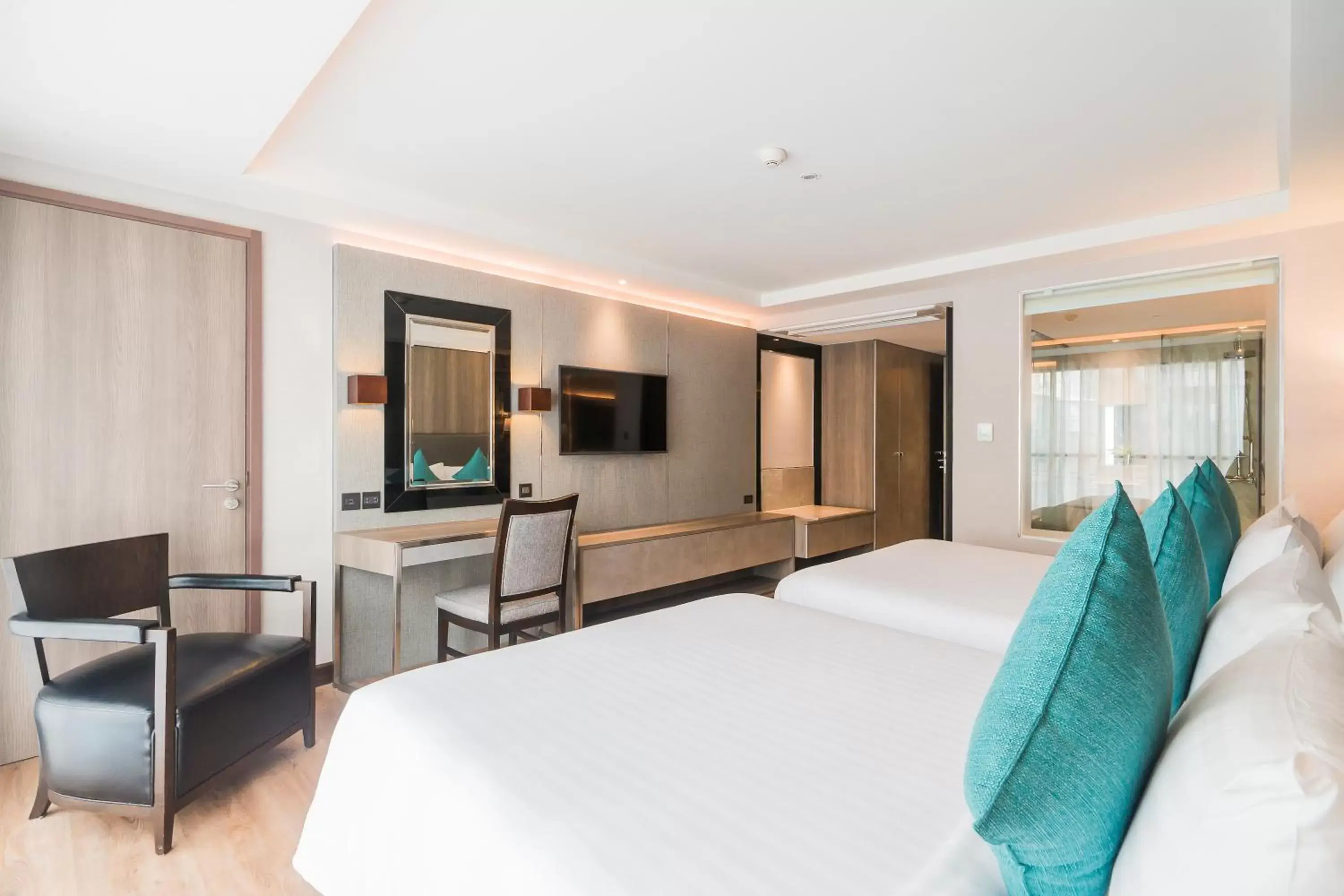 Bed, TV/Entertainment Center in Citrus Suites Sukhumvit 6 by Compass Hospitality