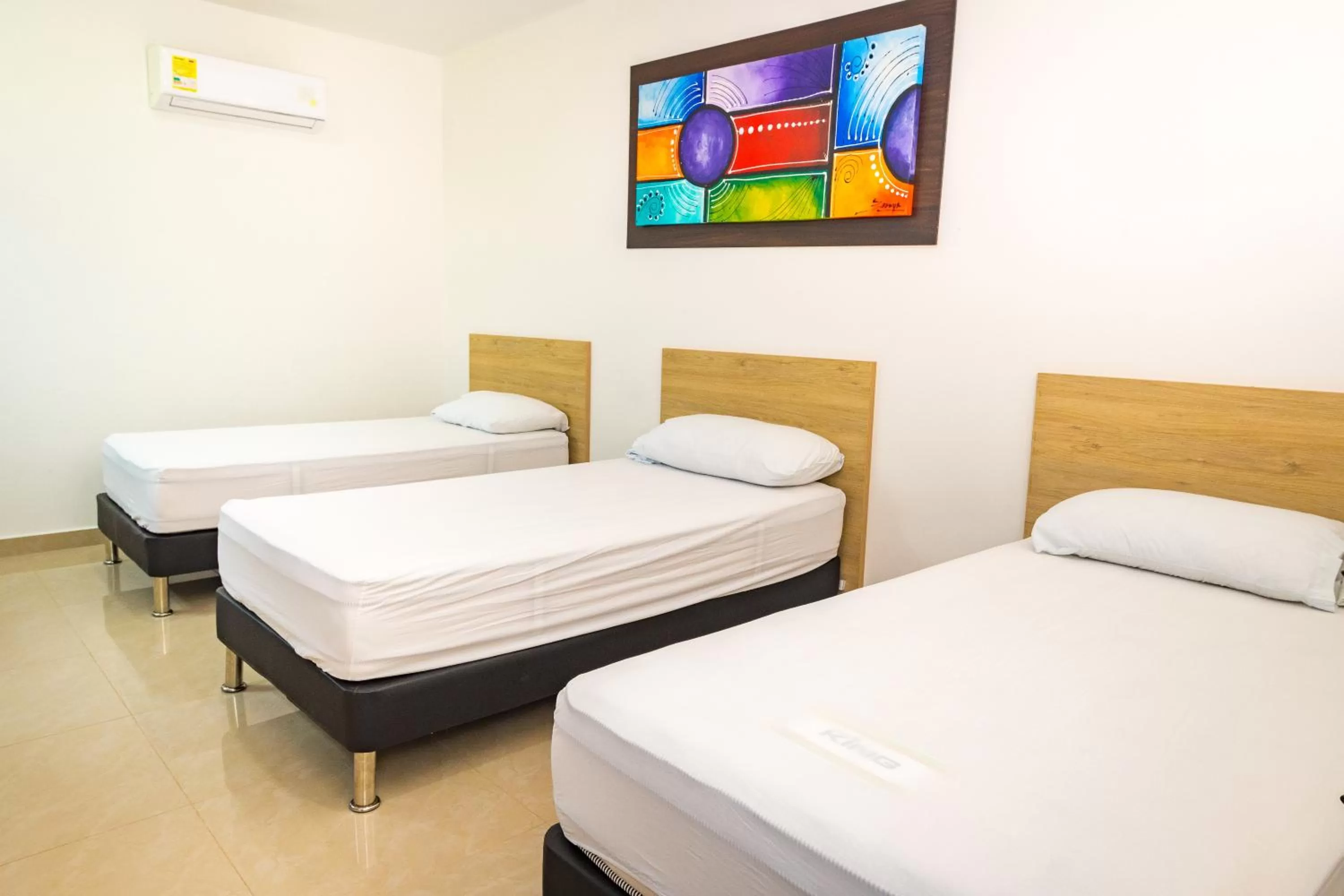 Bed in Genesis Hotel