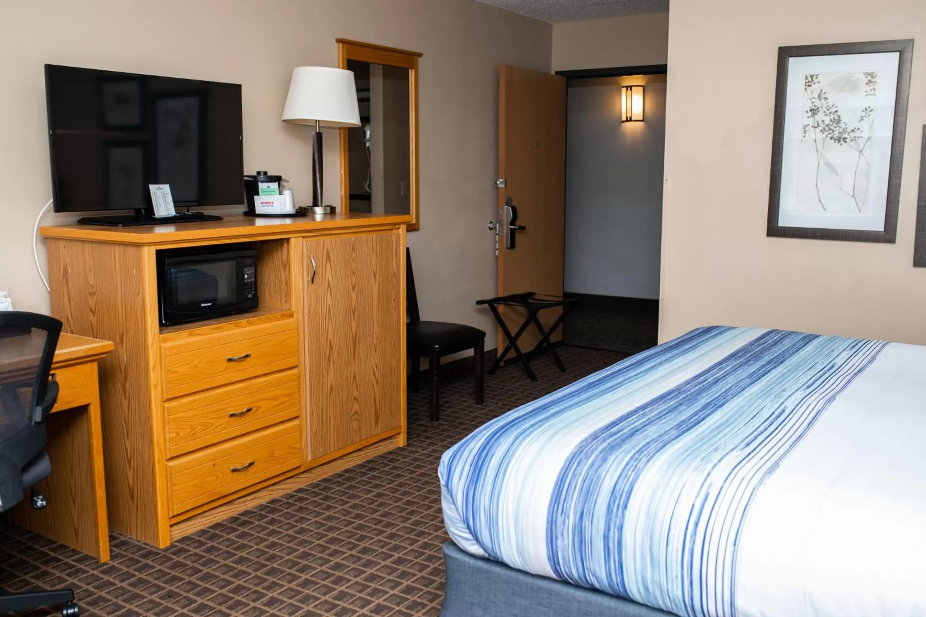 Bed in AmericInn by Wyndham Aberdeen Event Center