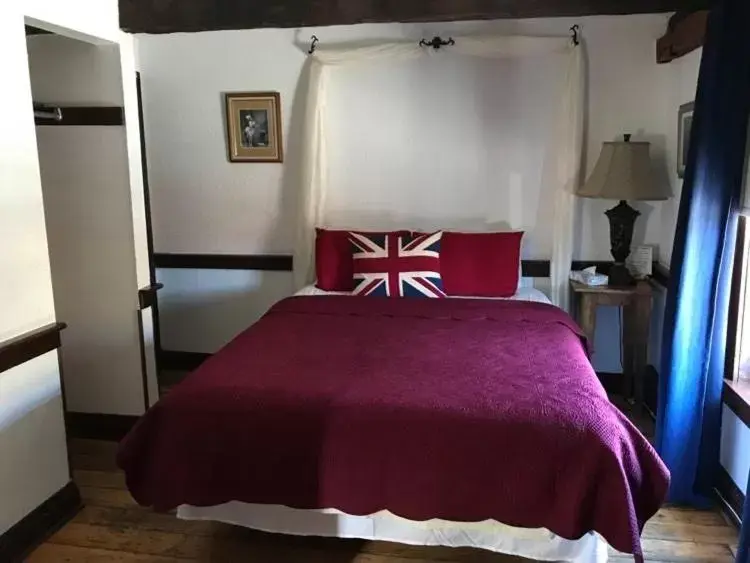Bed in The Olde Angel Inn