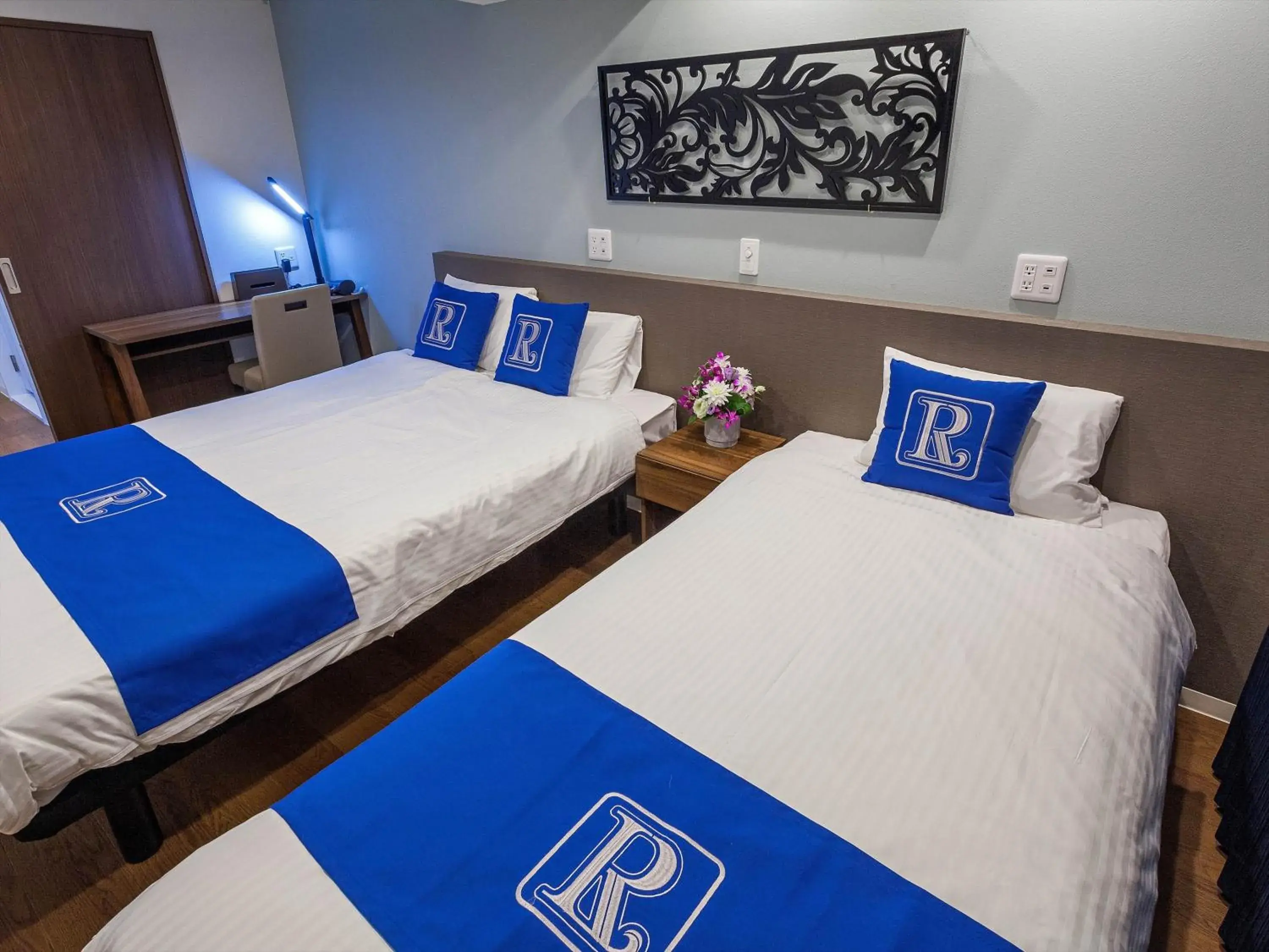 Bed in Kariyushi COndominium Resort Naha Living Inn Asahibashiekimae Annex and Premier