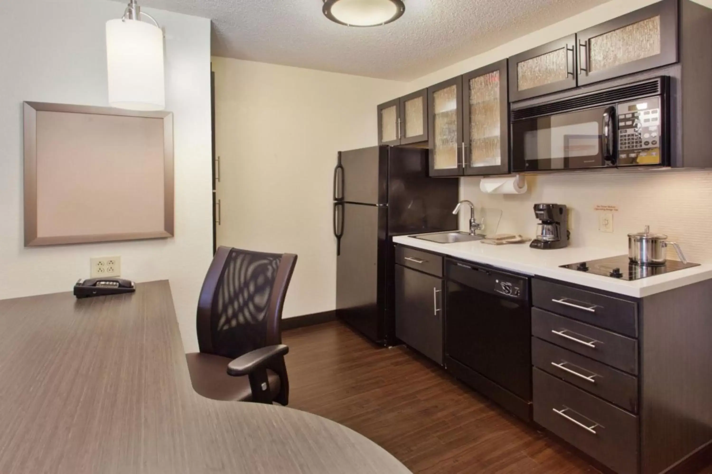 Photo of the whole room, Kitchen/Kitchenette in Candlewood Suites Pueblo, an IHG Hotel