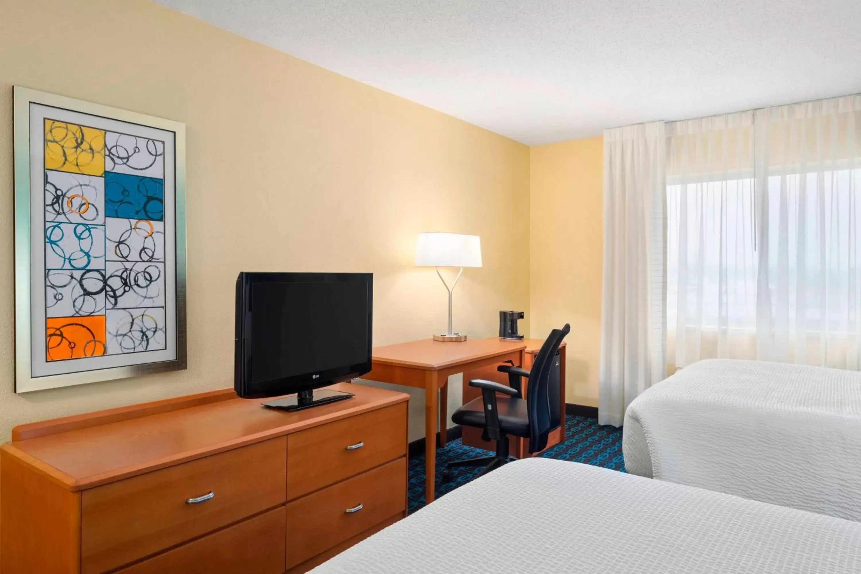 Photo of the whole room, TV/Entertainment Center in Fairfield Inn & Suites Lima