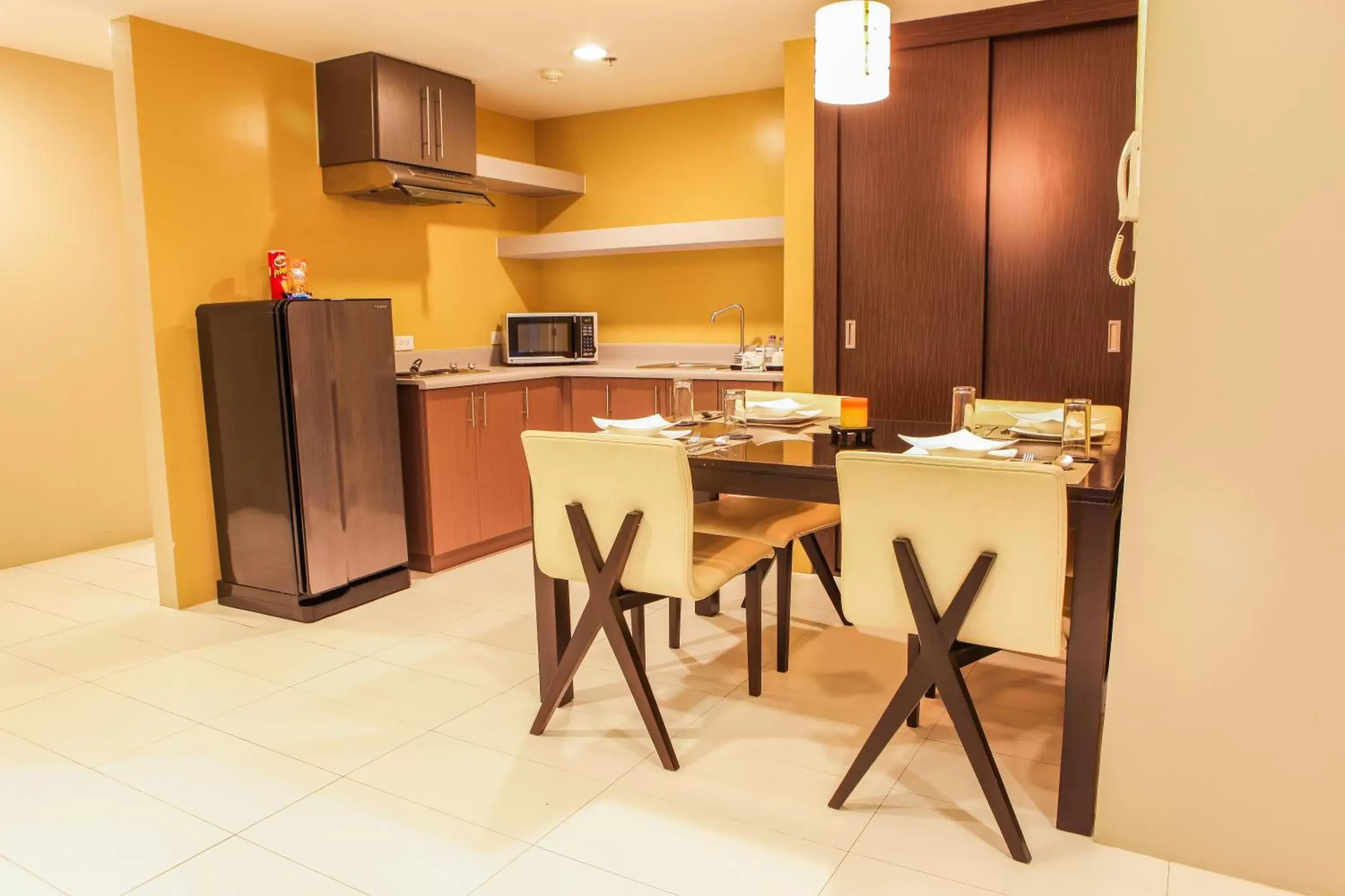 Kitchen or kitchenette, Kitchen/Kitchenette in The Exchange Regency Residence Hotel Managed by HII