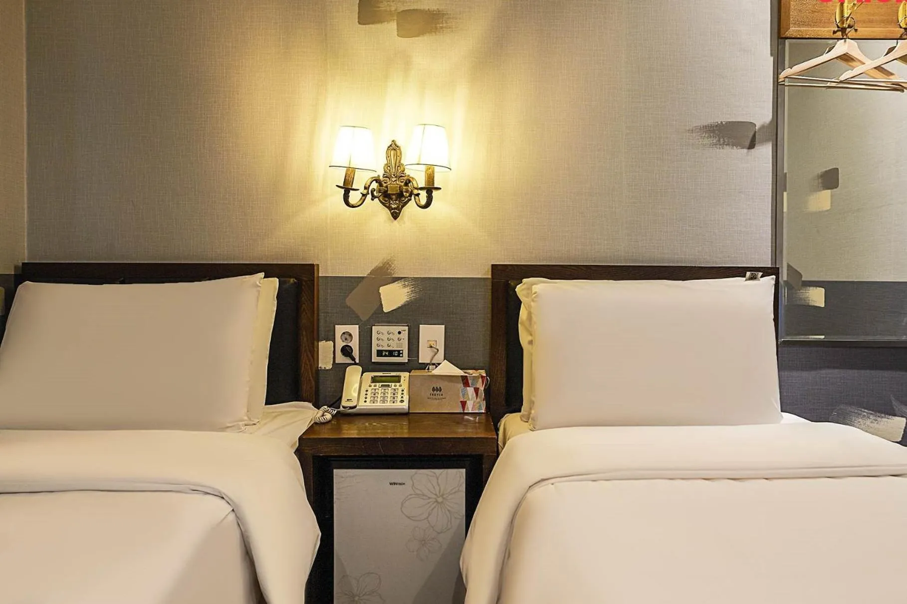 Bed in Friendly DH Naissance Hotel by Mindrum Group