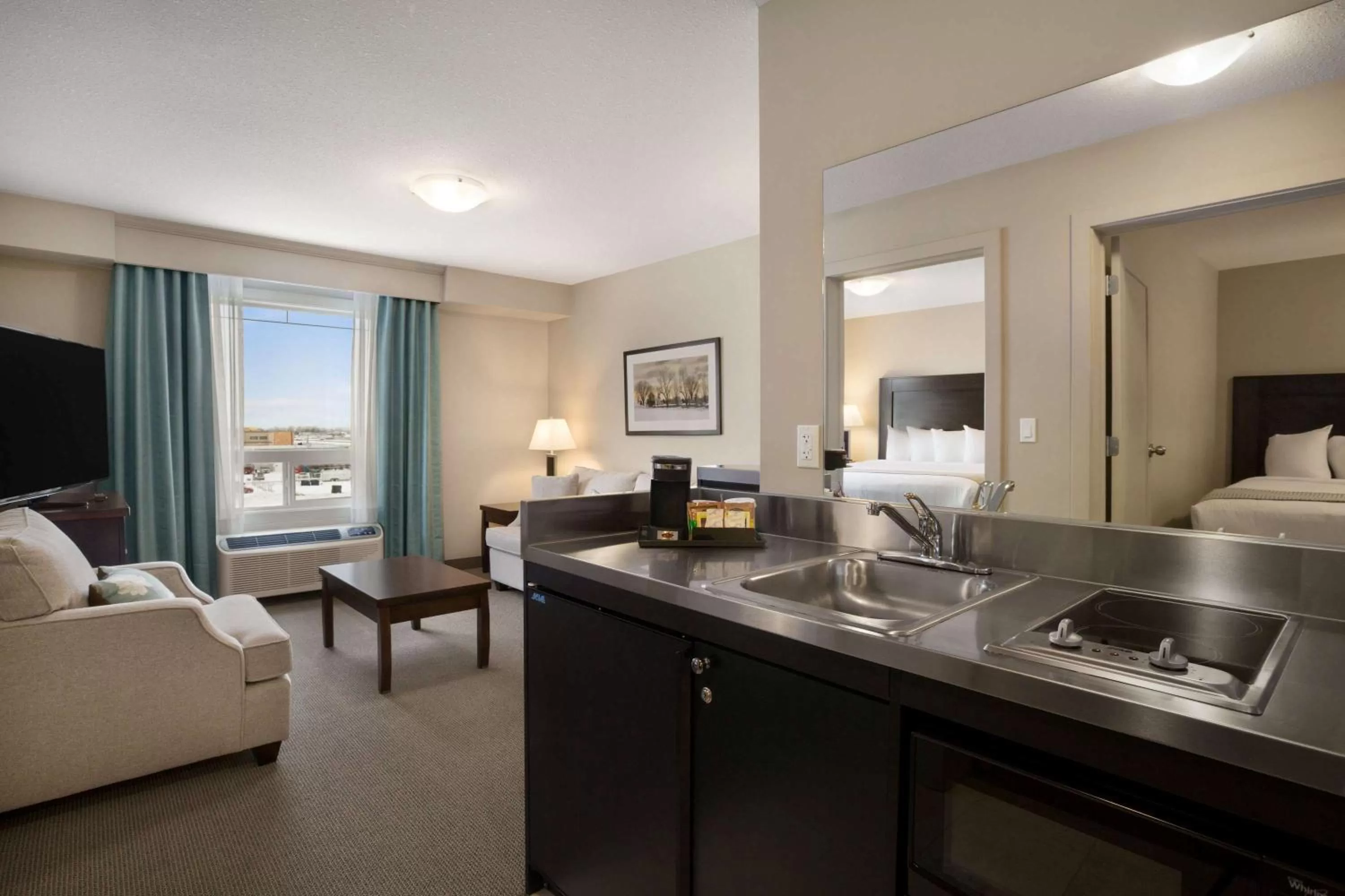 Photo of the whole room, Bed in Ramada by Wyndham Emerald Park/Regina East