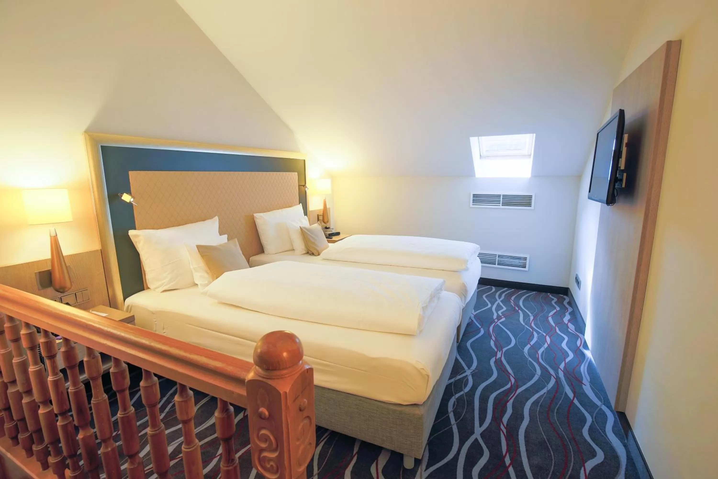 Photo of the whole room, Bed in Hotel Bayerischer Hof Miesbach, BW Premier Collection