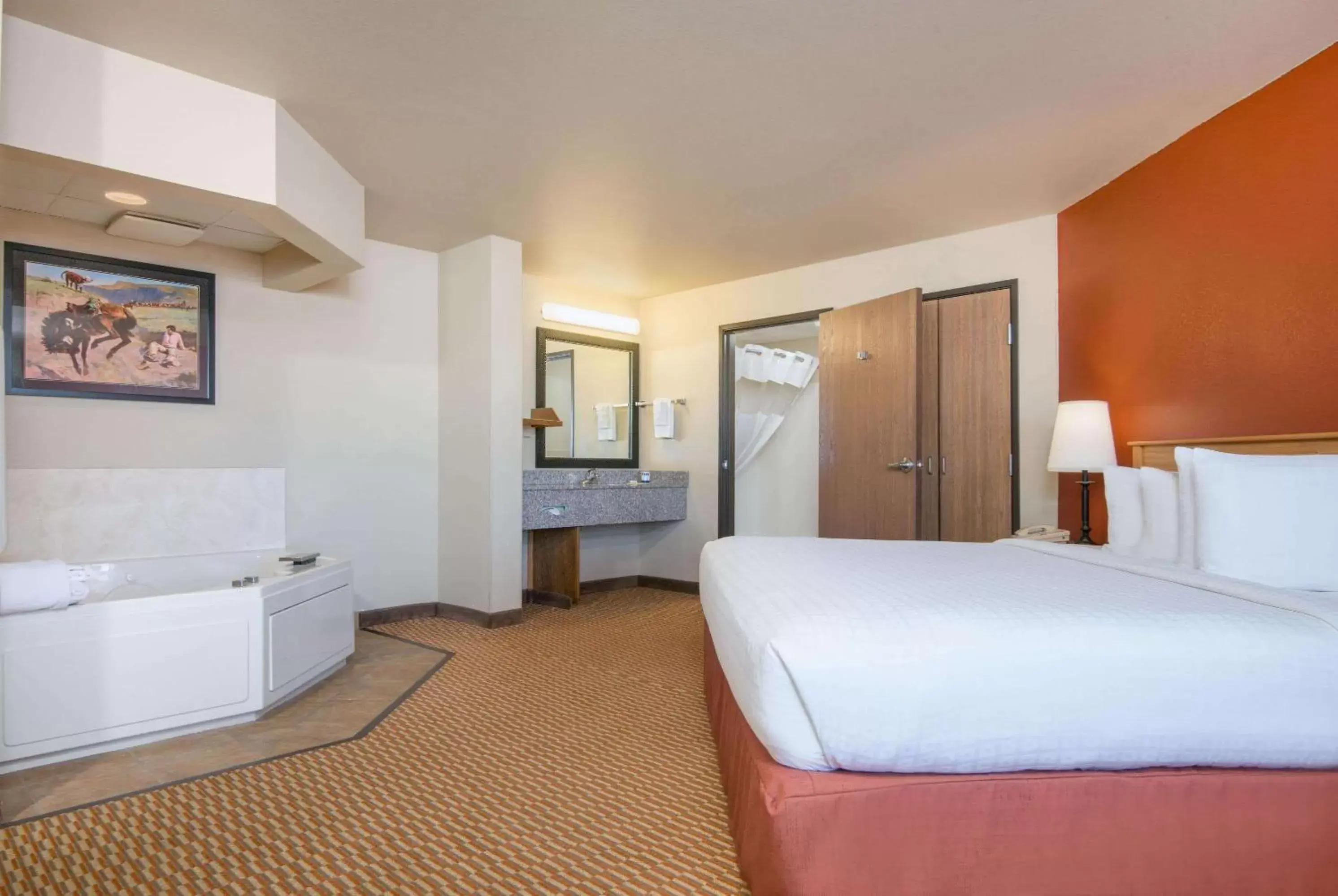 Bed in AmericInn by Wyndham Pampa Event Center