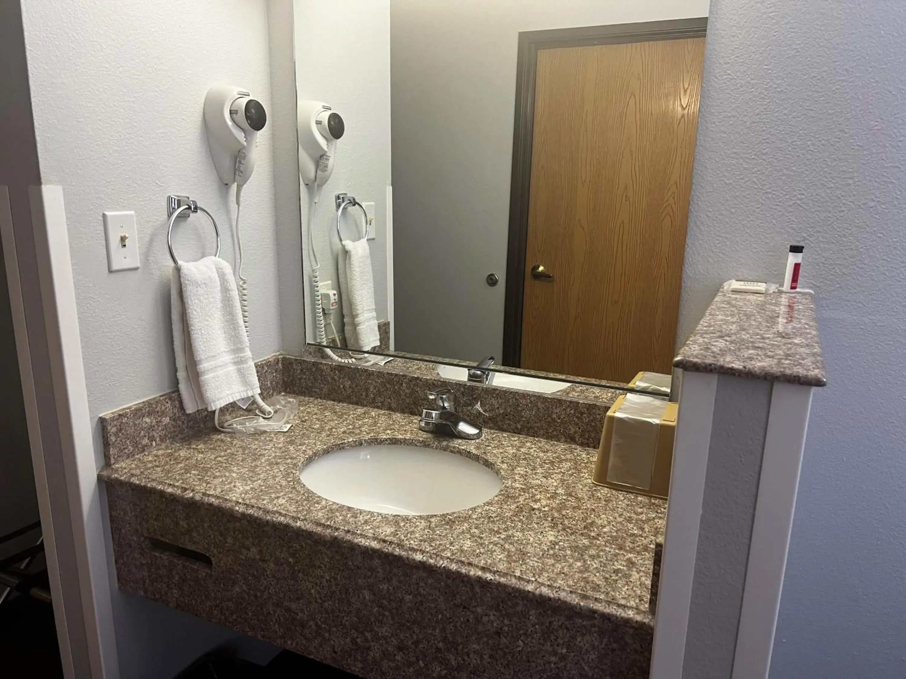 Bathroom in Super 8 by Wyndham Cleveland TX