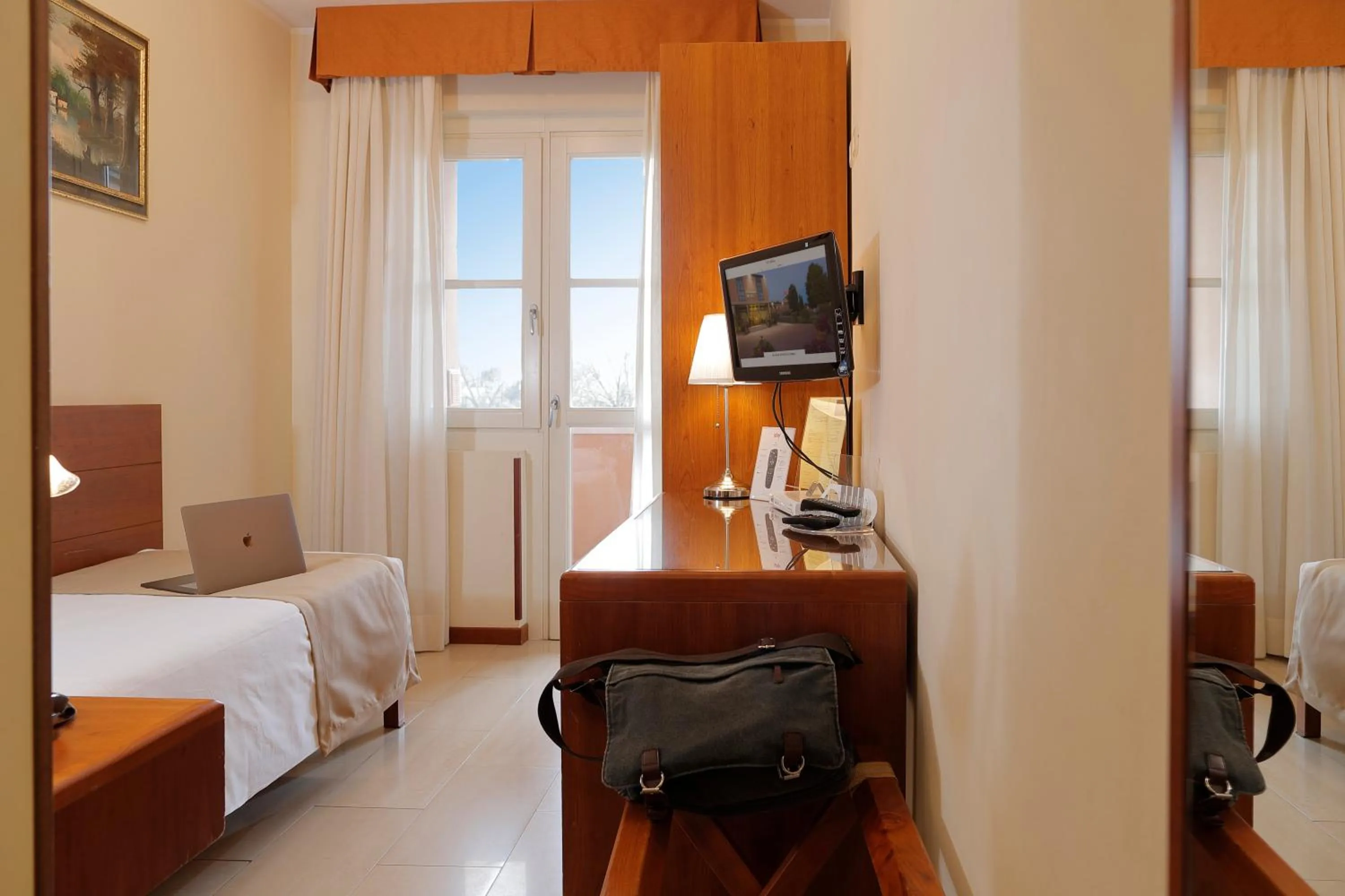 Bed in Hotel Michelangelo