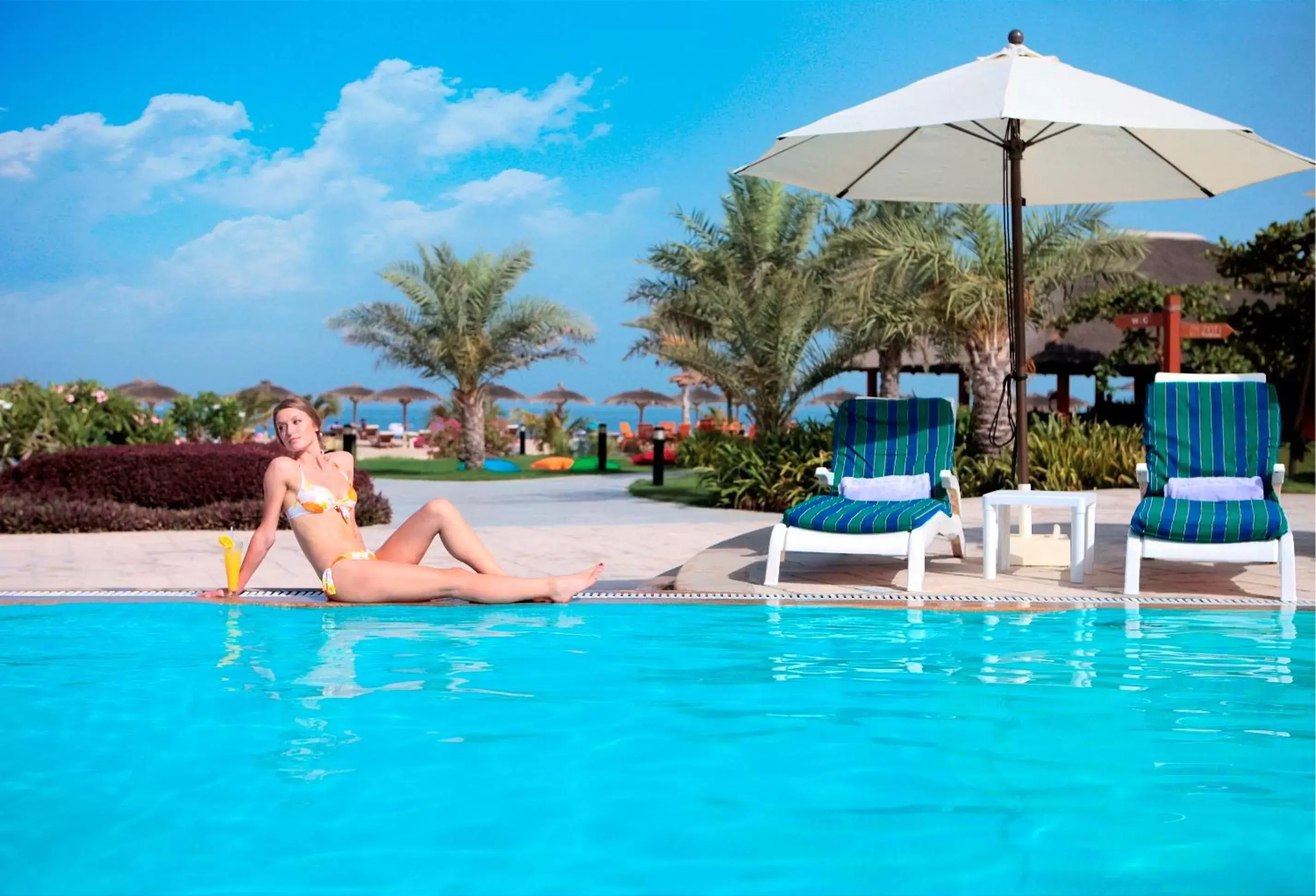 People, Swimming Pool in Fujairah Rotana Resort & Spa - Al Aqah Beach