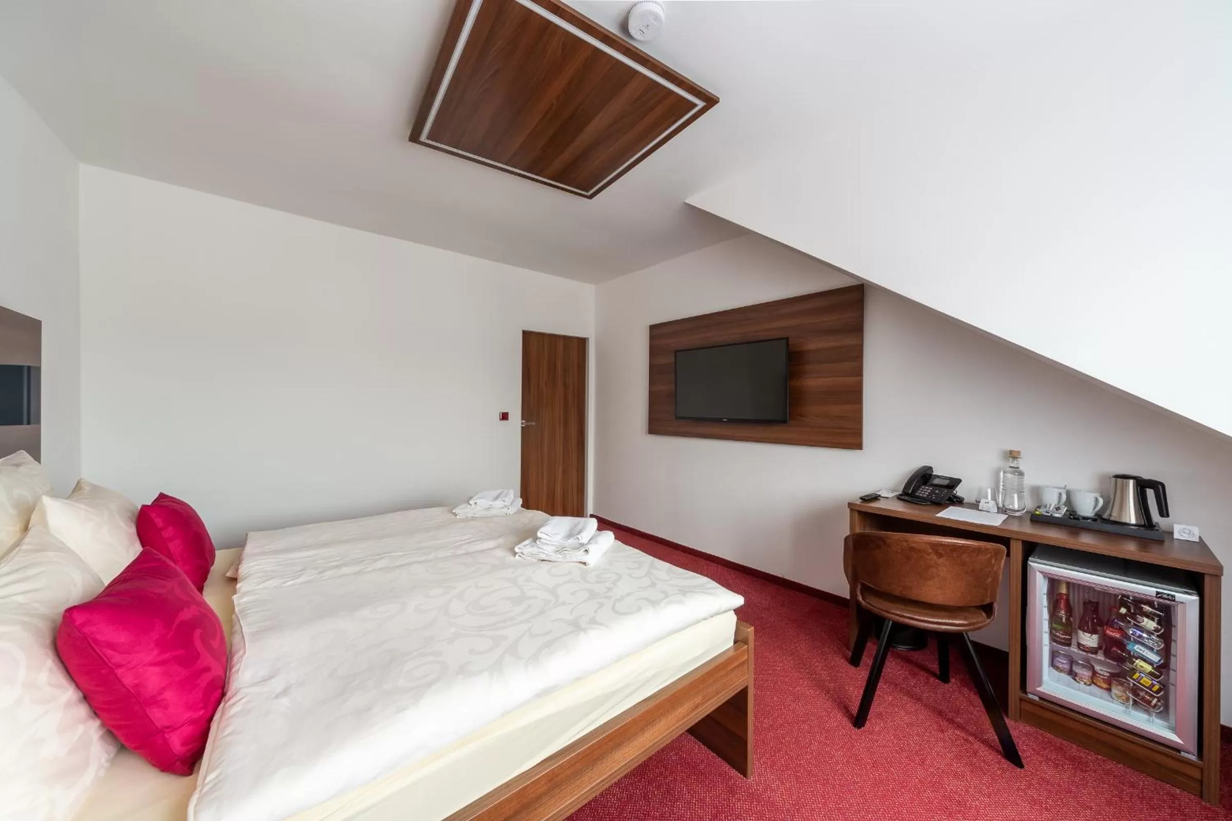 Bed in Bohemia Inn Hotel