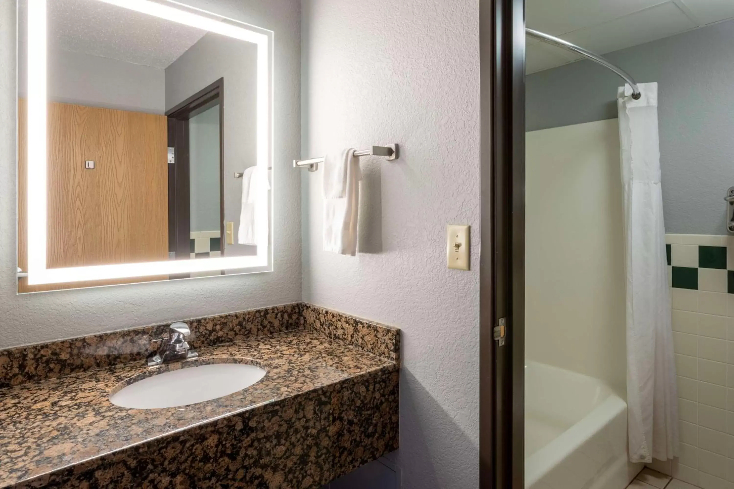 Bathroom in Black Beach Inn by GrandStay