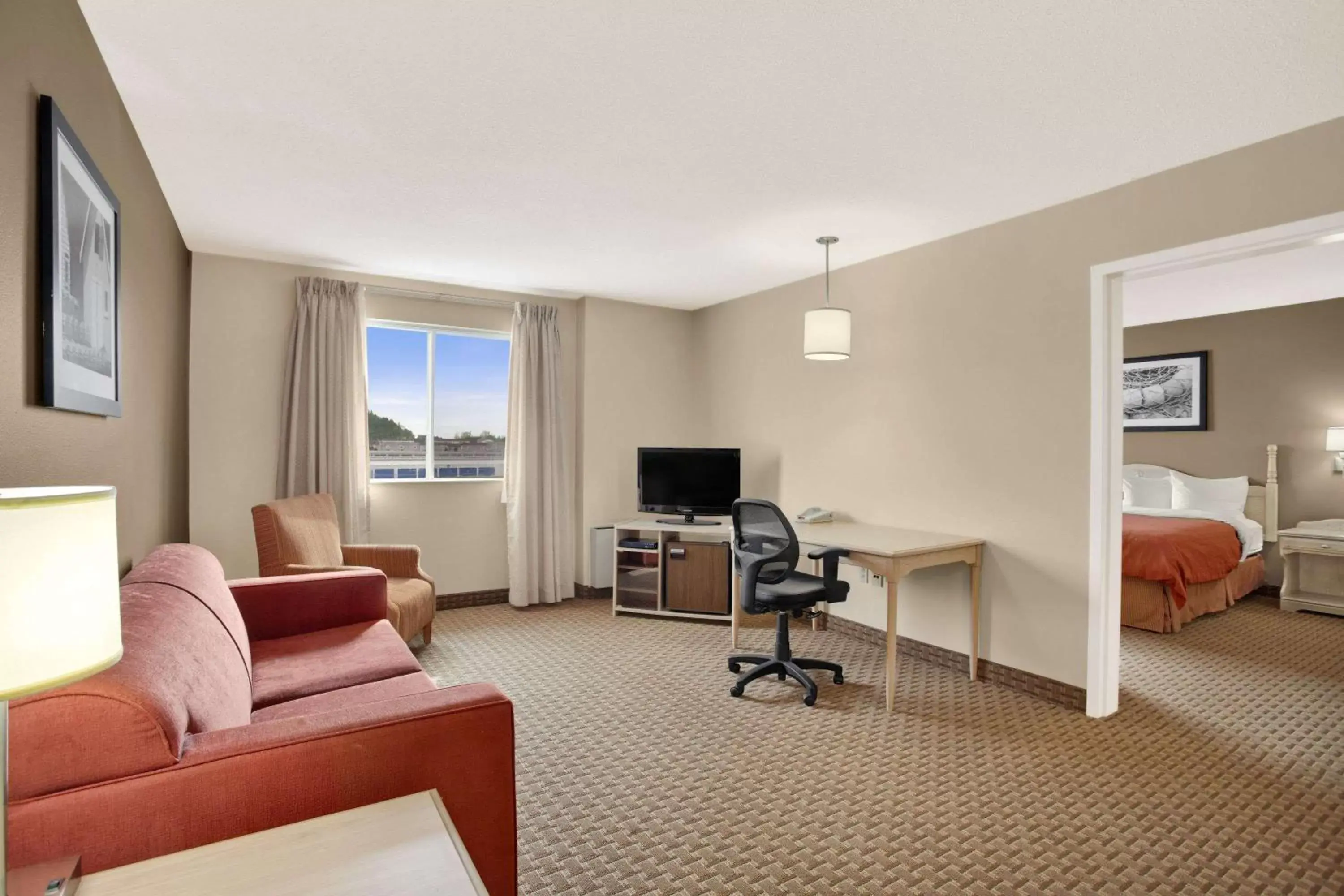 Photo of the whole room, Seating Area in Travelodge Suites by Wyndham Saint John