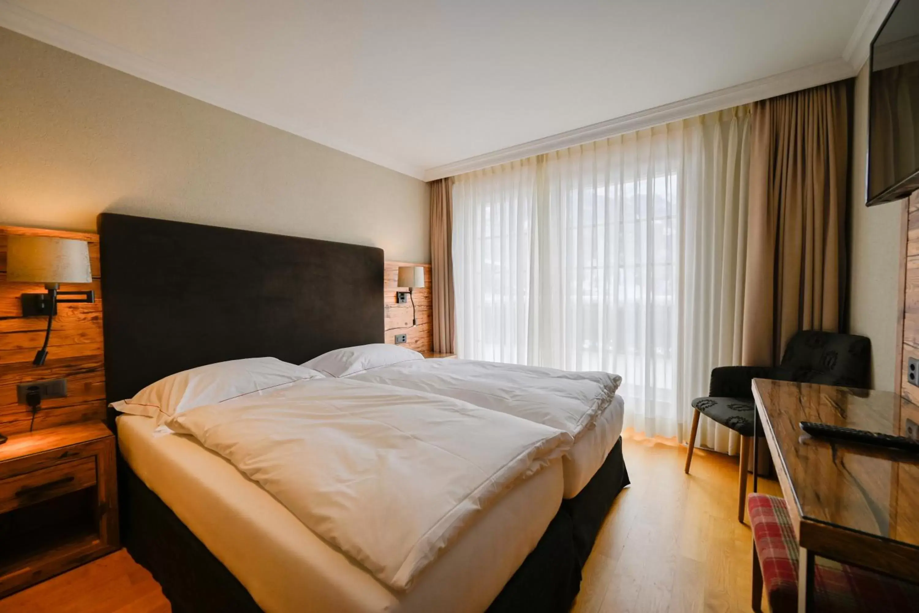 Bedroom, Bed in Romantik Hotel Schweizerhof