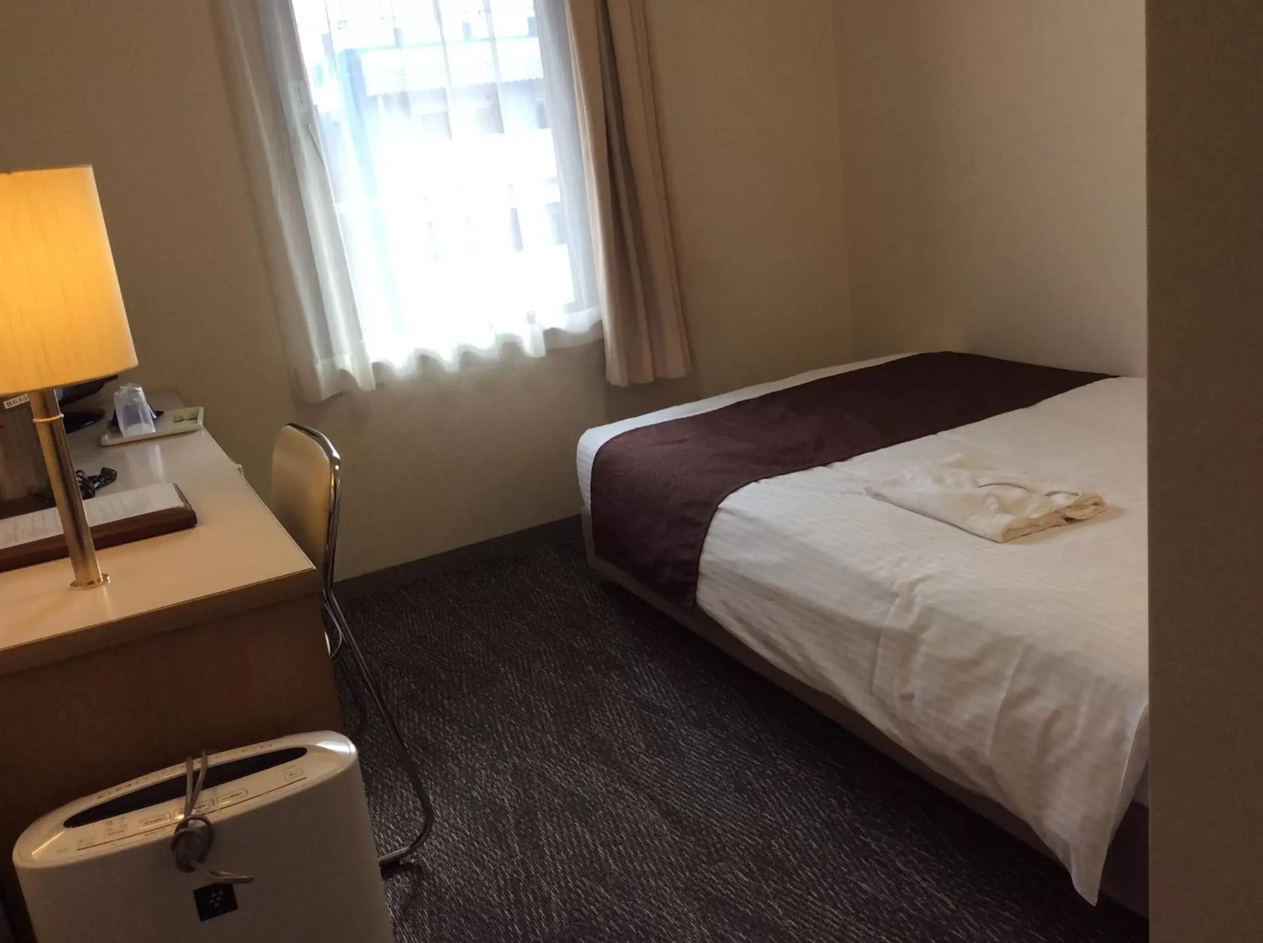 Bed in Shin-Osaka Sunny Stone Hotel Bed in Shin-Osaka Sunny Stone Hotel