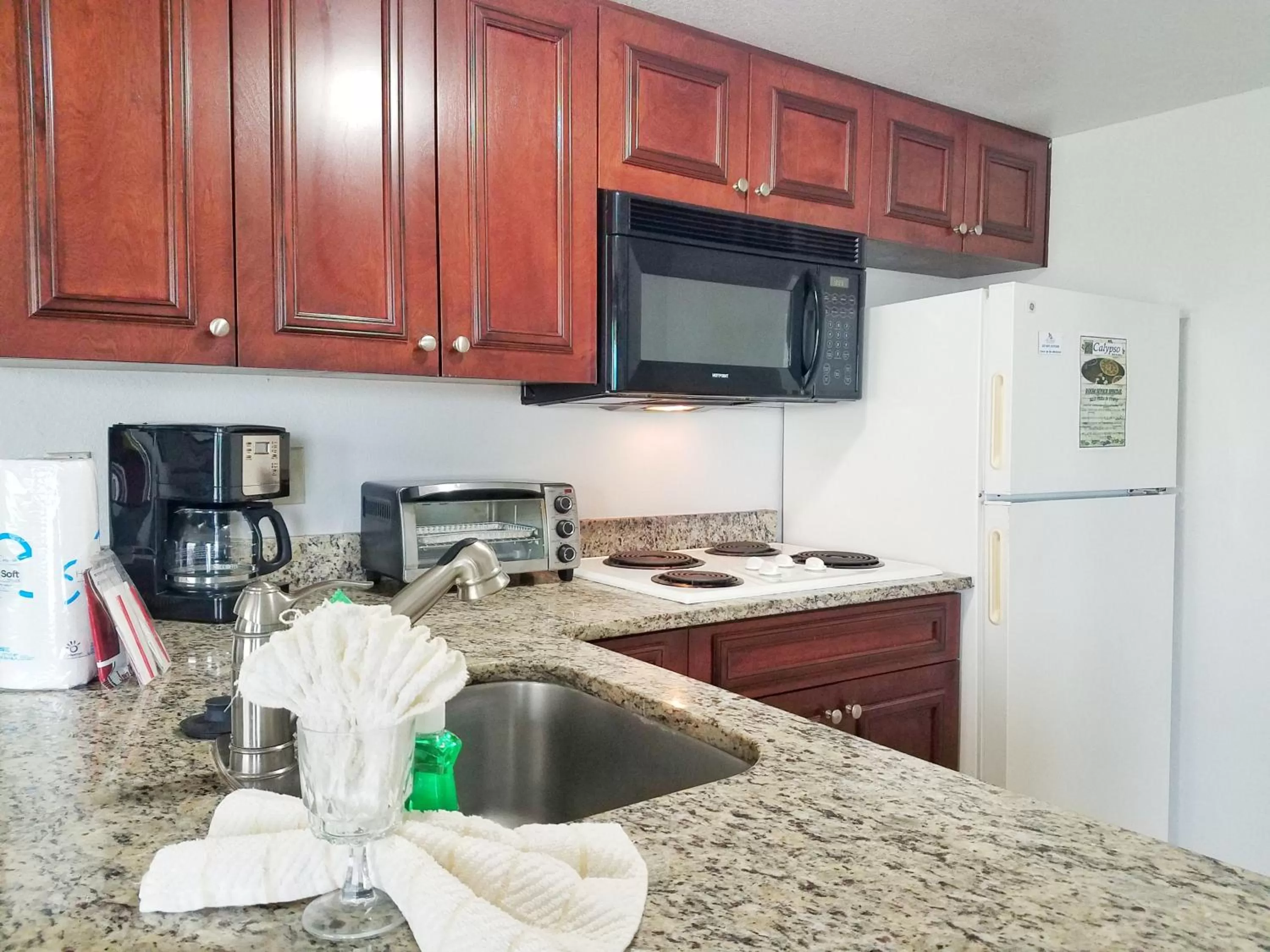 Kitchen or kitchenette in Parc Corniche Condominium Suites