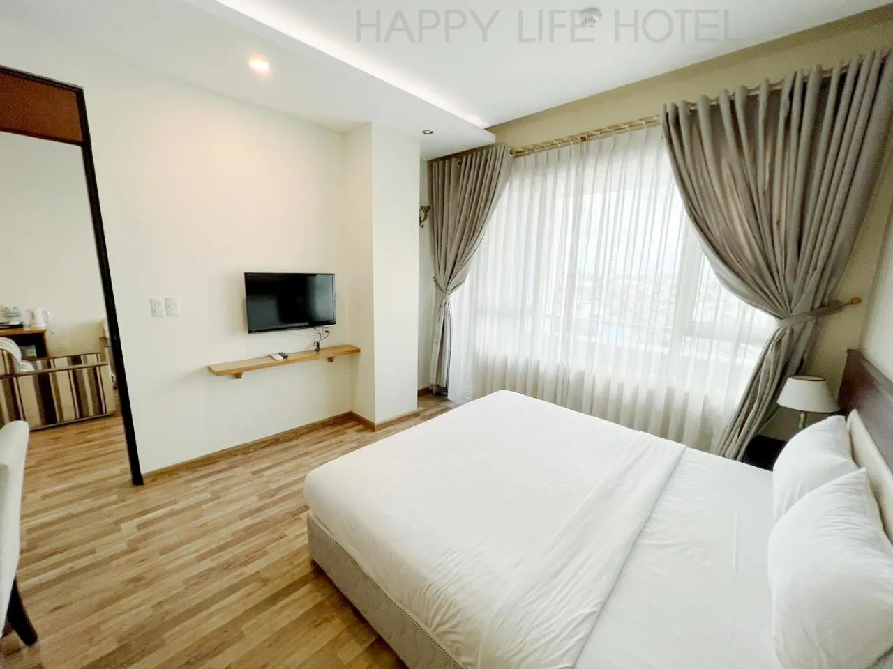 Communal lounge/ TV room, Bed in Happy Life Hotel District 7 Gần SECC