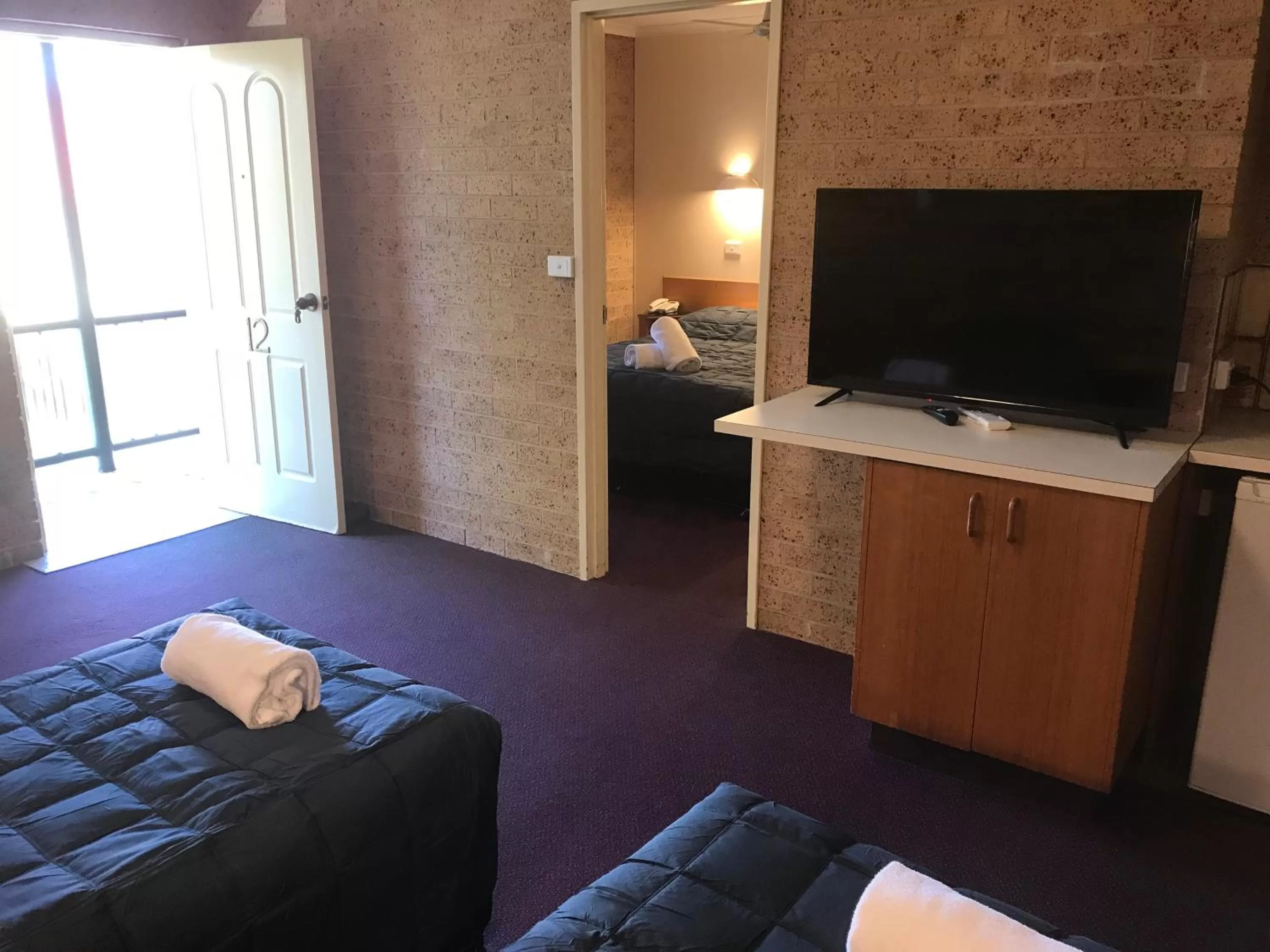 Bed in Cedar Lodge Motel