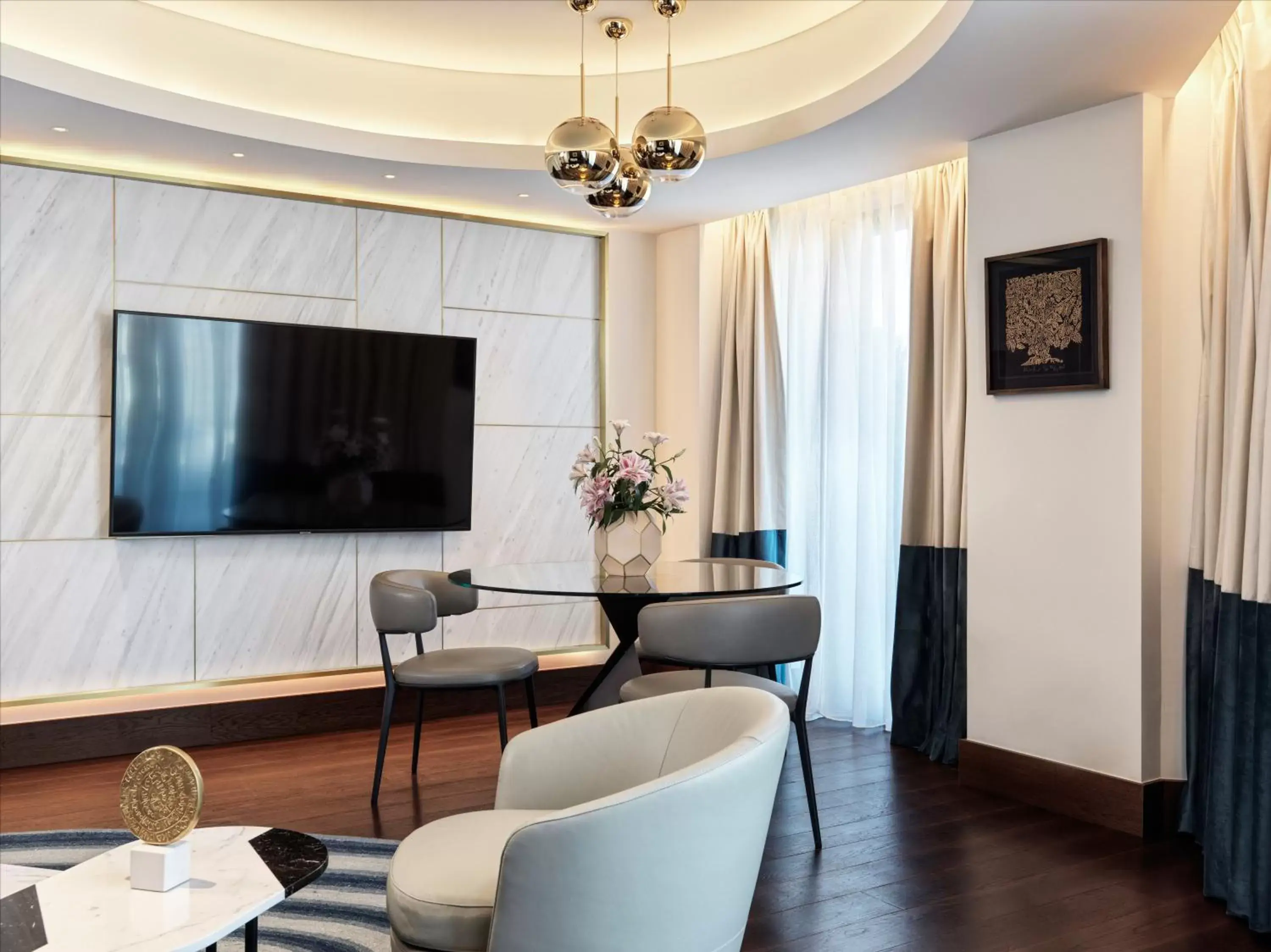 Seating area, TV/Entertainment Center in Athens Capital Center Hotel - MGallery Collection