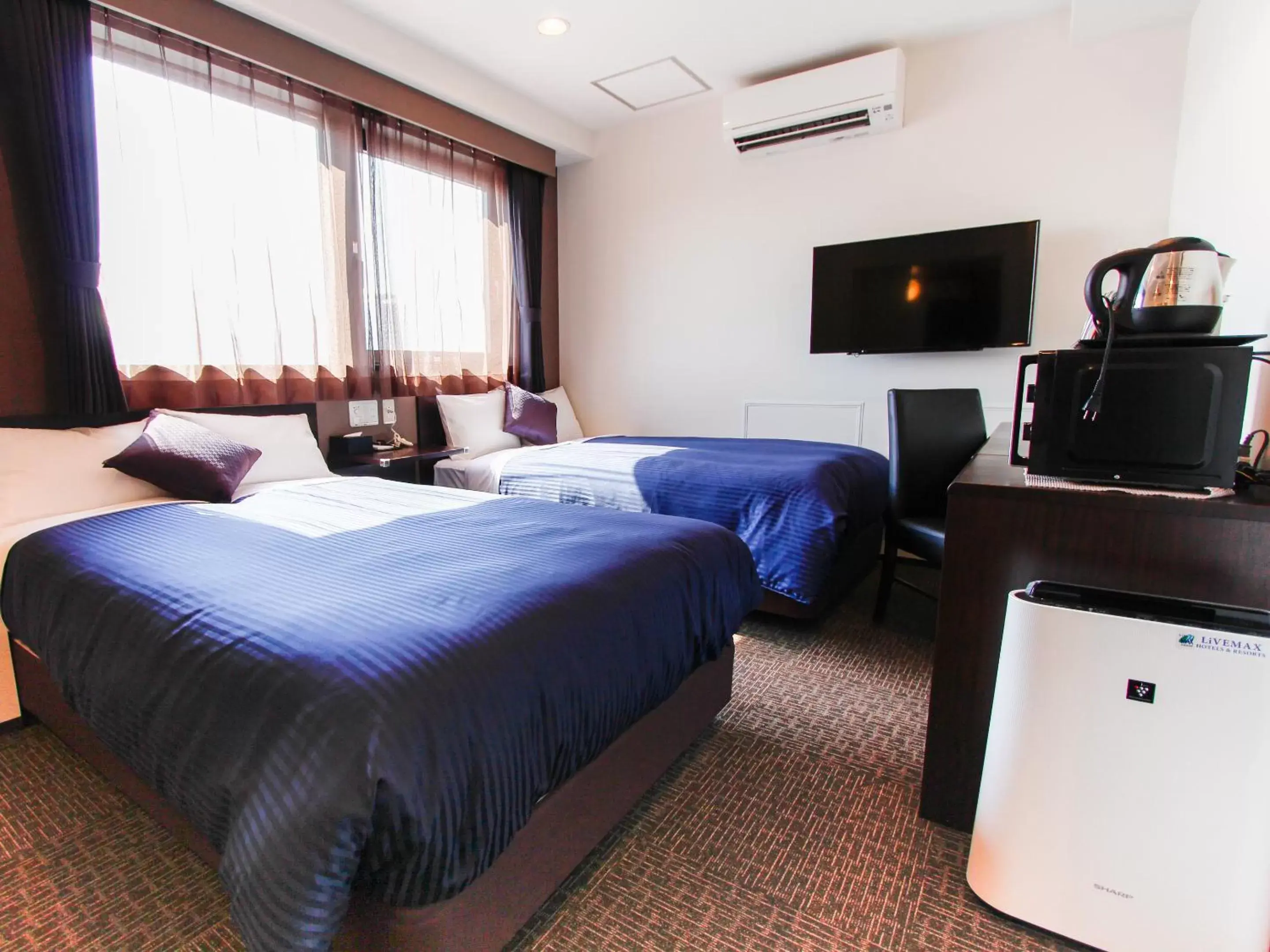 Bed in HOTEL LiVEMAX Osaka Dome Mae Hotel