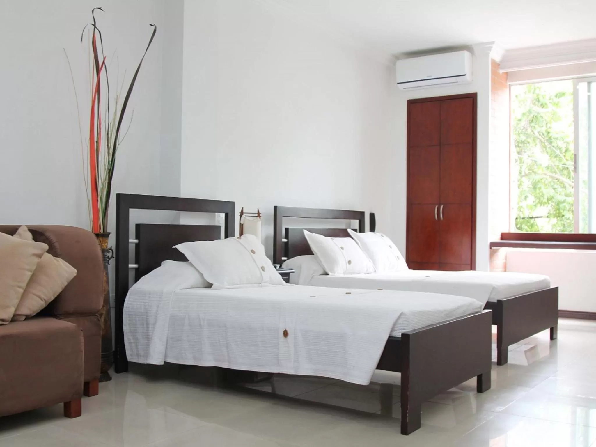 Bed in Pampalinda Hotel