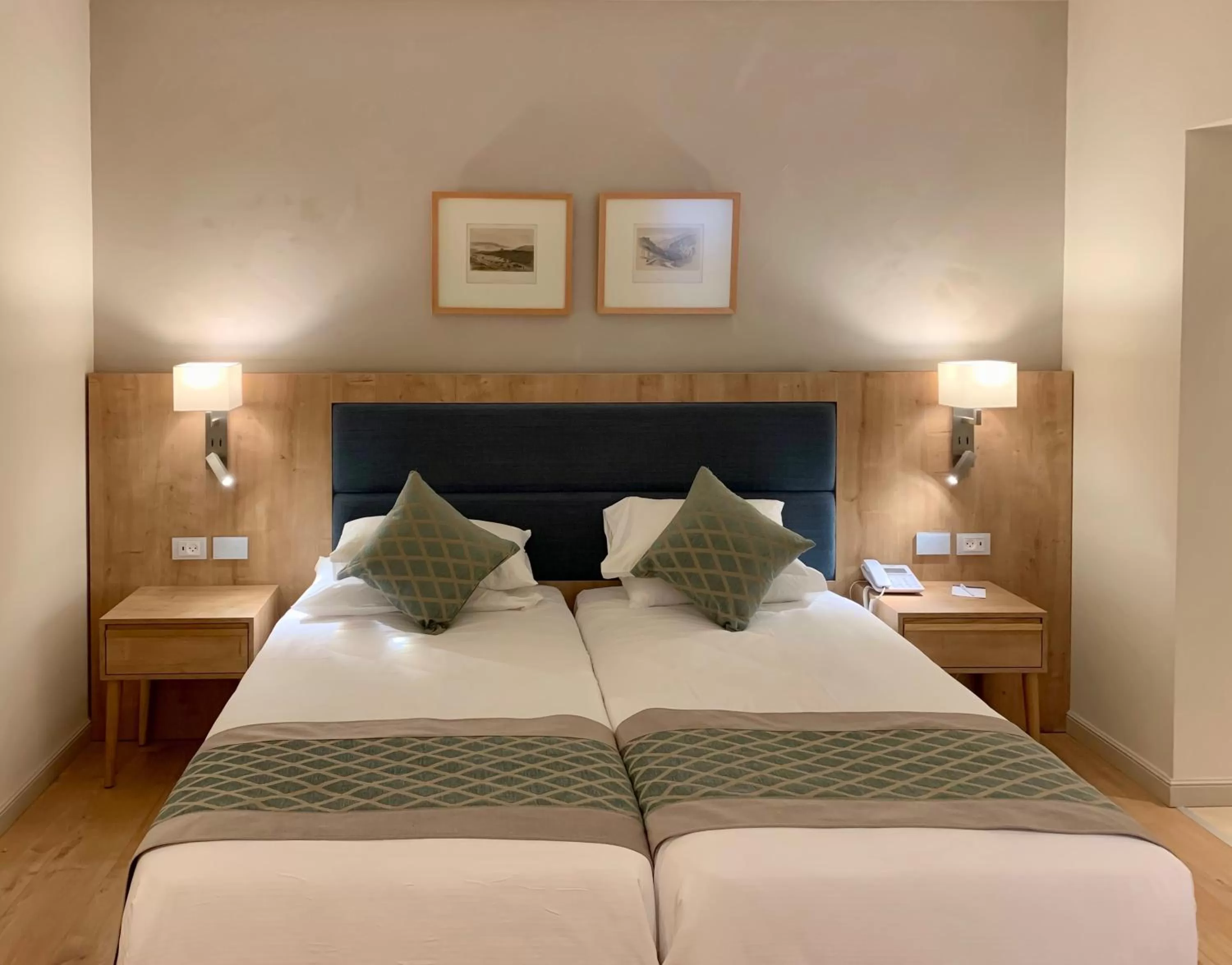 Bed in Ambassador Boutique Hotel