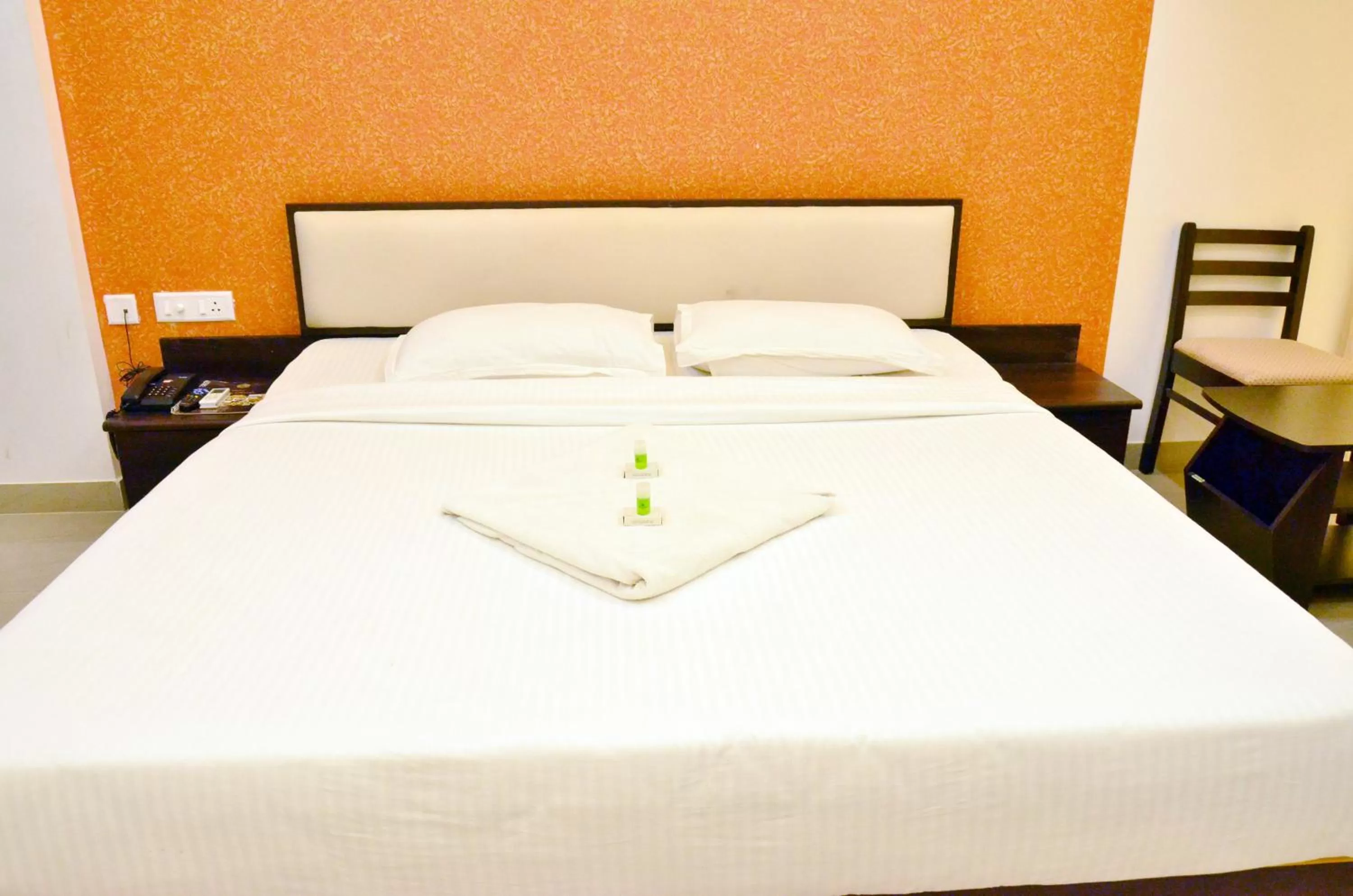 Bed in Hotel Ambai Grand