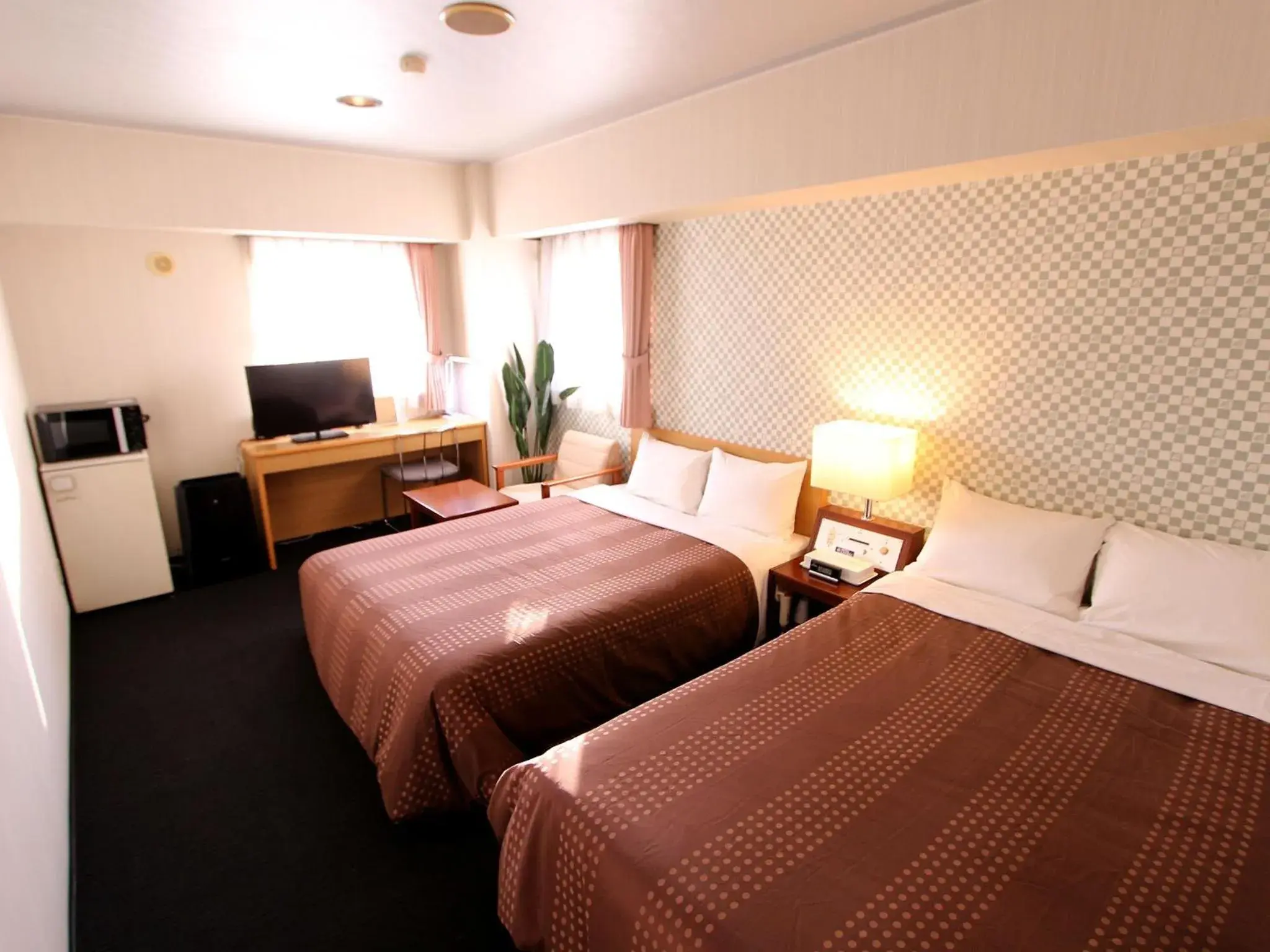 Bed in HOTEL LiVEMAX BUDGET Chitose