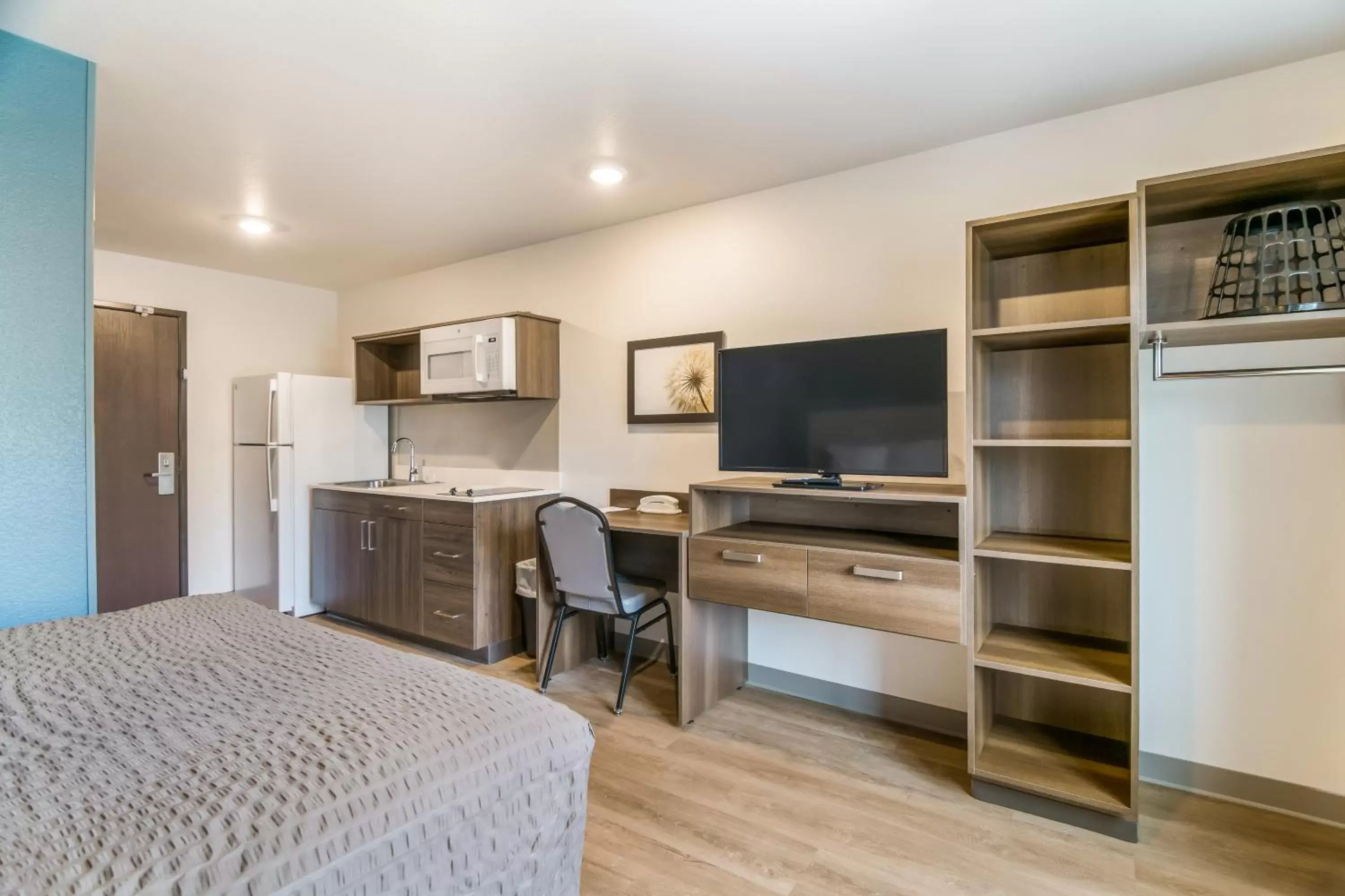 Photo of the whole room, TV/Entertainment Center in WoodSpring Suites Broomfield-Westminster