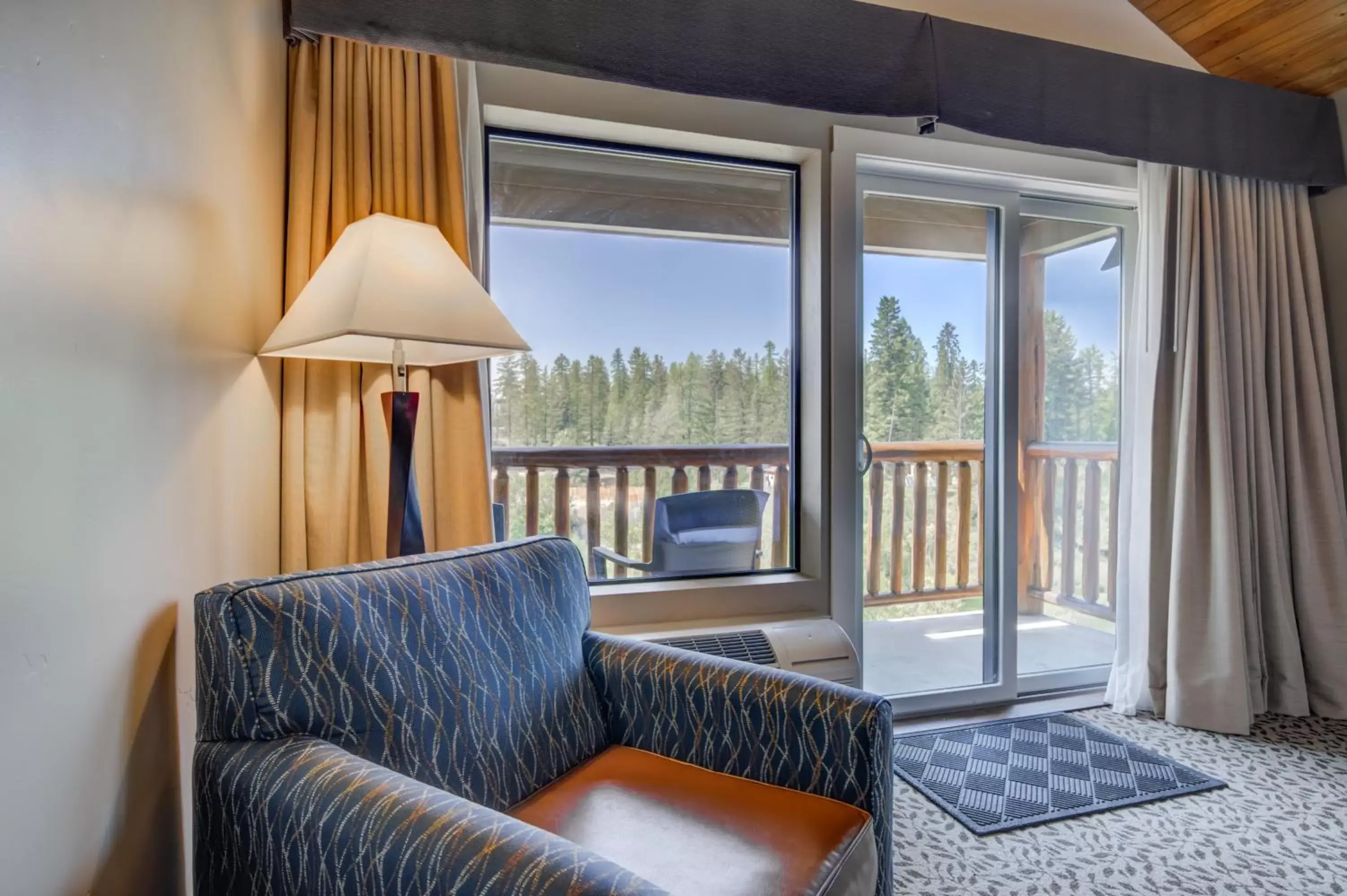 Bedroom, Seating Area in The Pine Lodge on Whitefish River, Ascend Hotel Collection