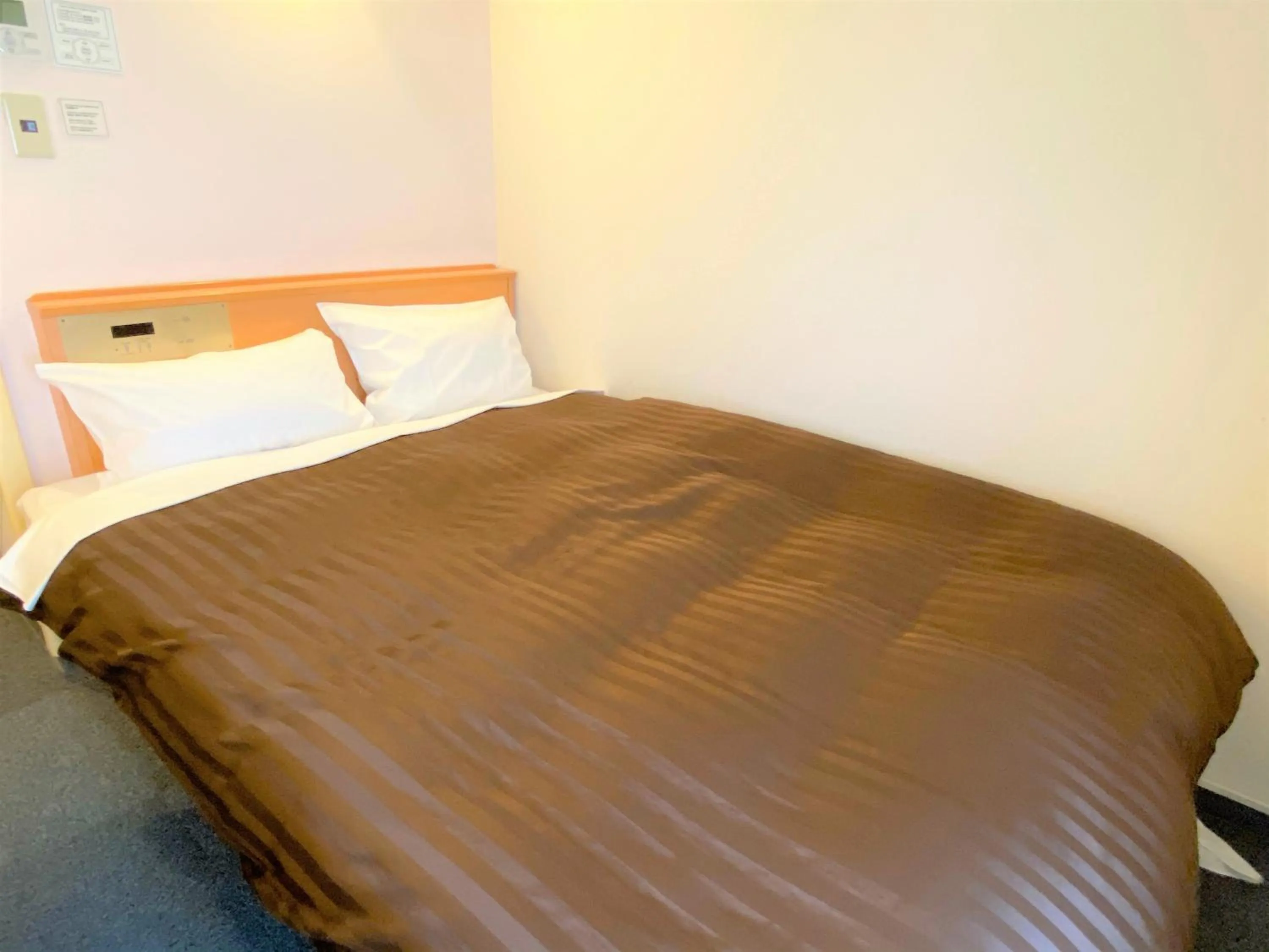 Bed in Sakura Hotel Hatagaya