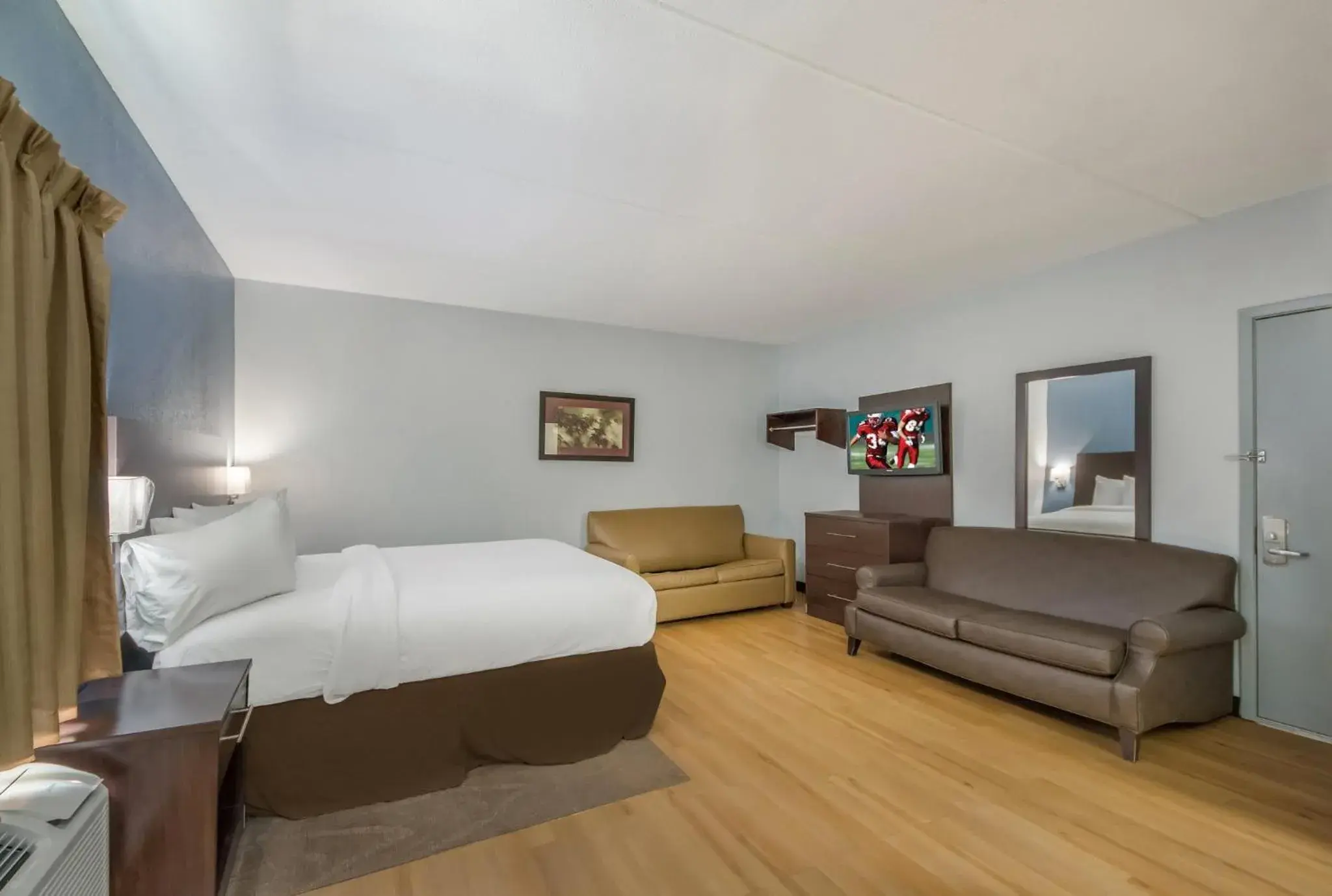 Bedroom in HomeTowne Studios by Red Roof San Antonio - SeaWorld Northwest