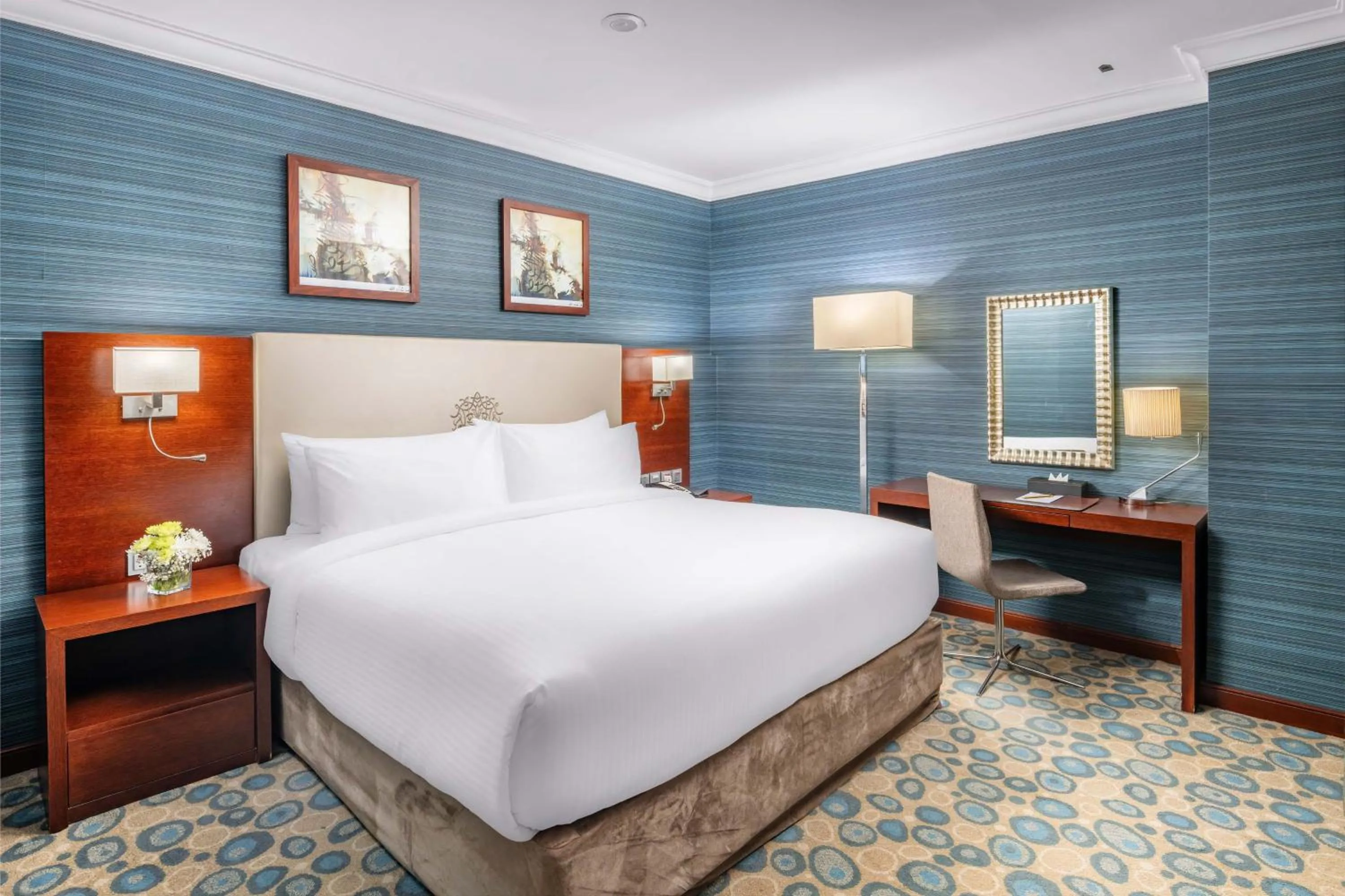 Bed in Millennium Al Aqeeq Hotel