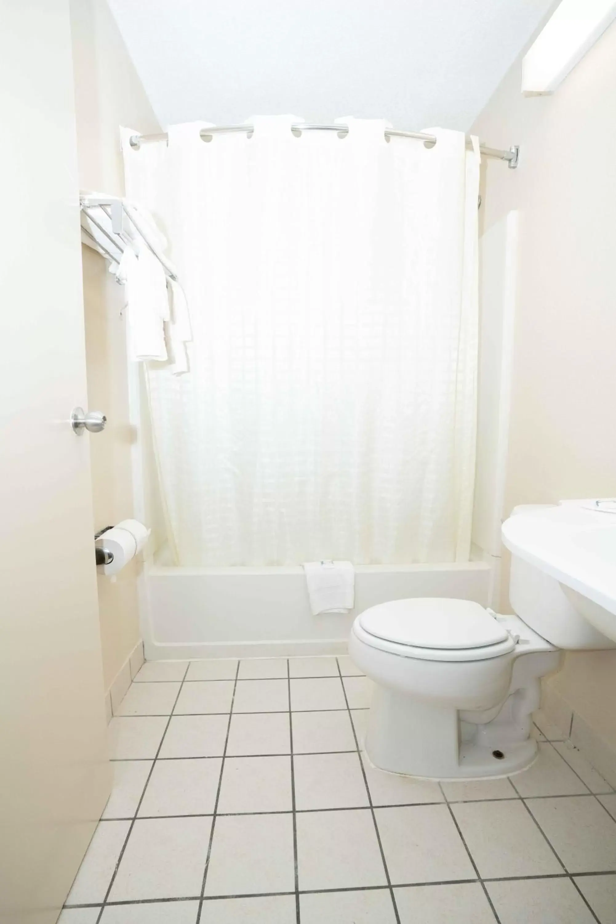 Toilet, Bathroom in Regency Inn & Suites DFW