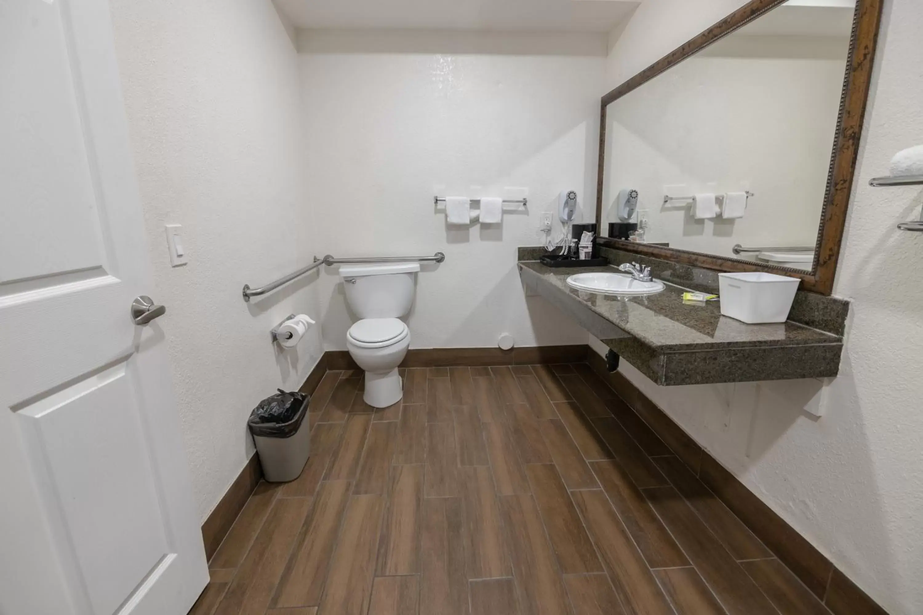 Toilet, Bathroom in Hospitality Inn