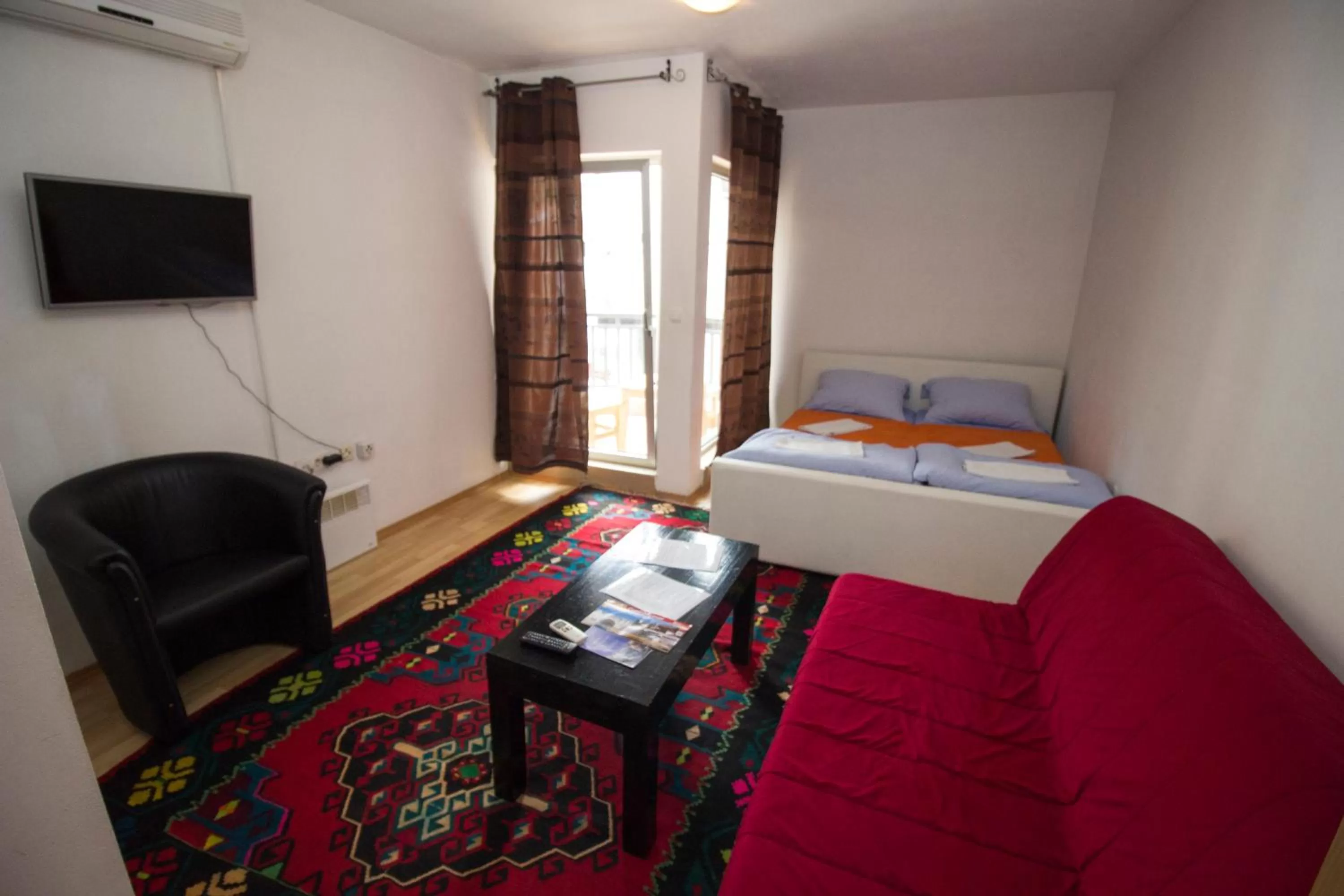 Bed, Seating Area in Hotel & Rooms Lombrelle