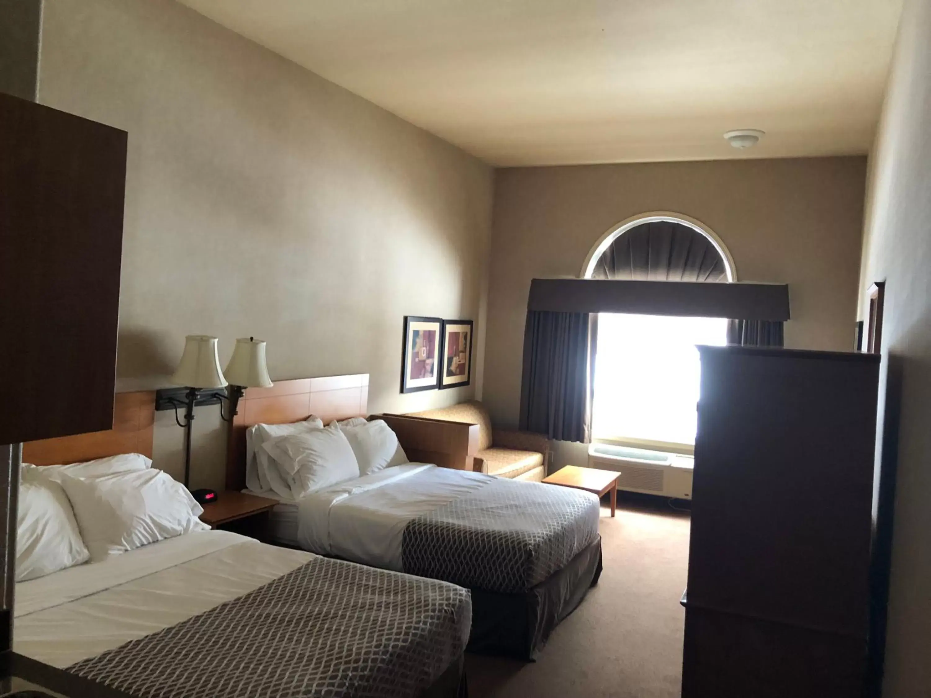 Swimming pool, Bed in Ramada by Wyndham Ponoka