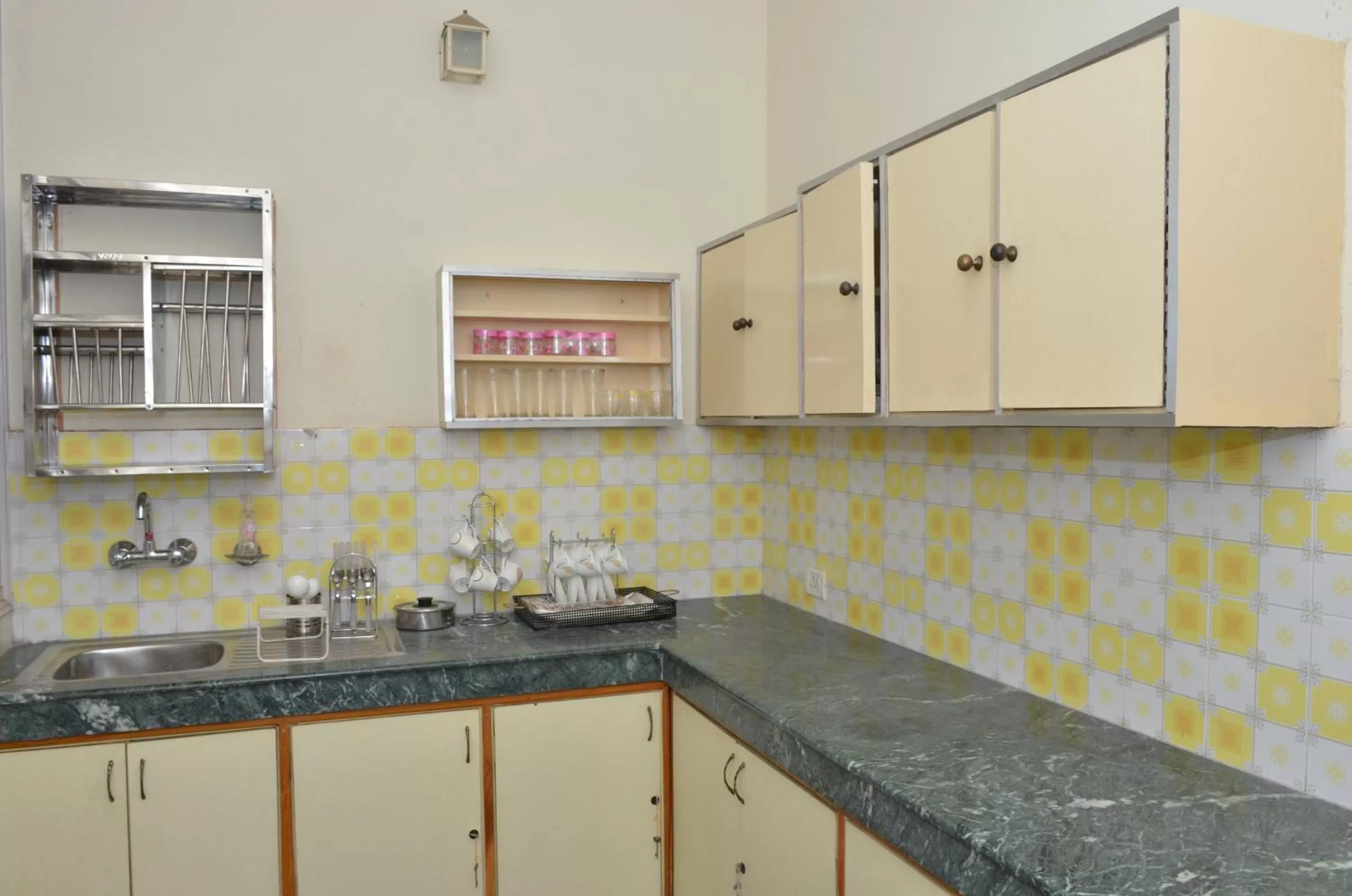 Kitchen or kitchenette in Sandy's Homestay