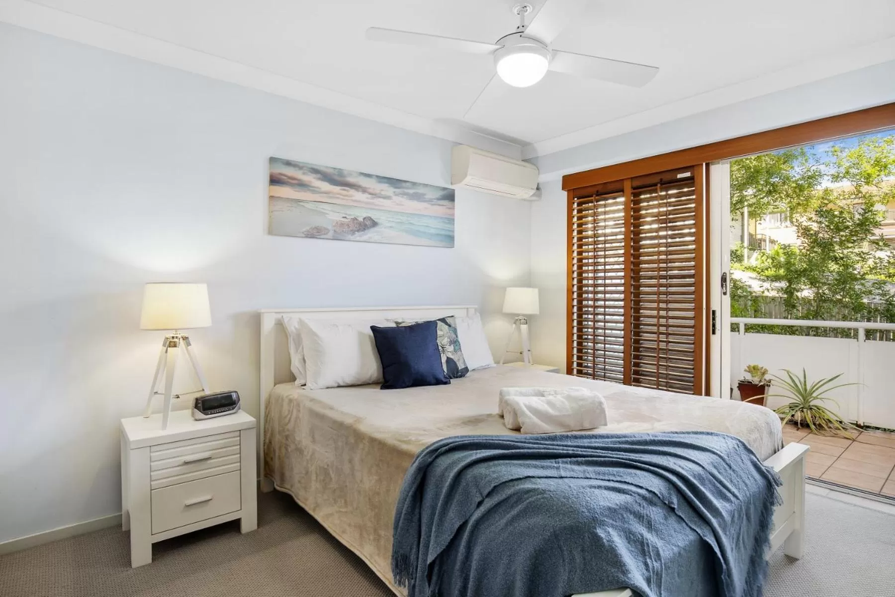 Bed in Kirra Palms Holiday Apartments