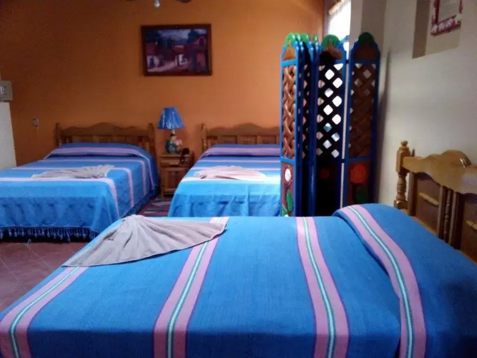 Bed in Hotel Cazomalli Oaxaca