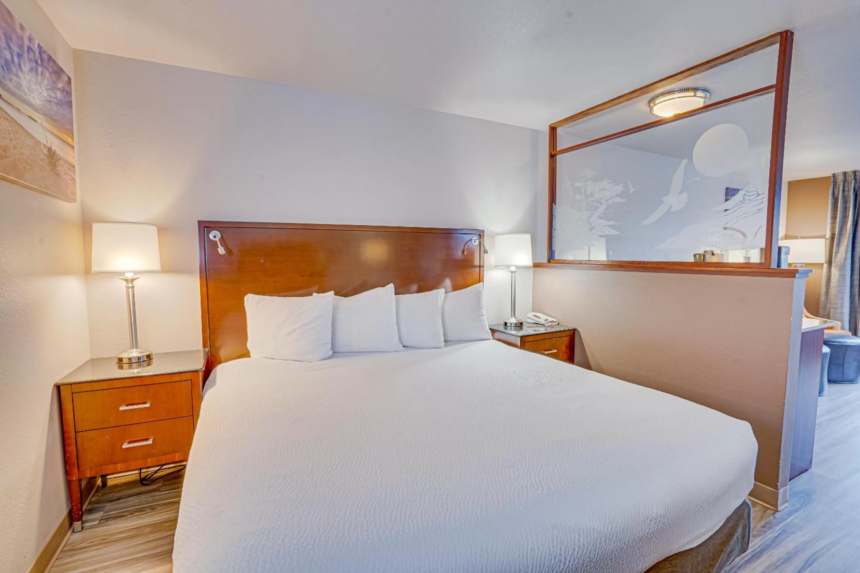 Bed in The Ashley Inn & Suites