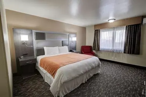Bed in Bonanza Inn and Suites