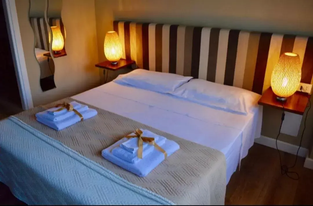 Bed in Battisti Rooms & Breakfast