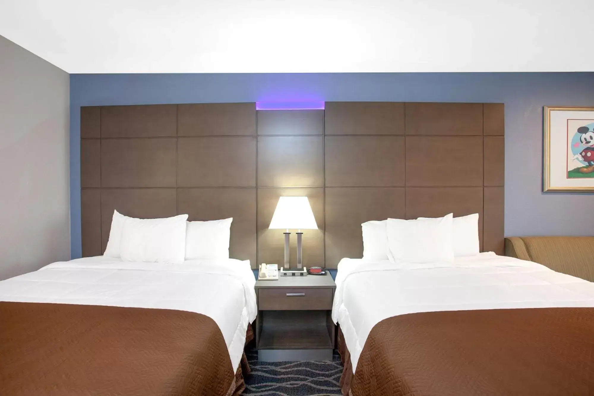 Bed in Travelodge Inn & Suites by Wyndham Anaheim on Disneyland Dr