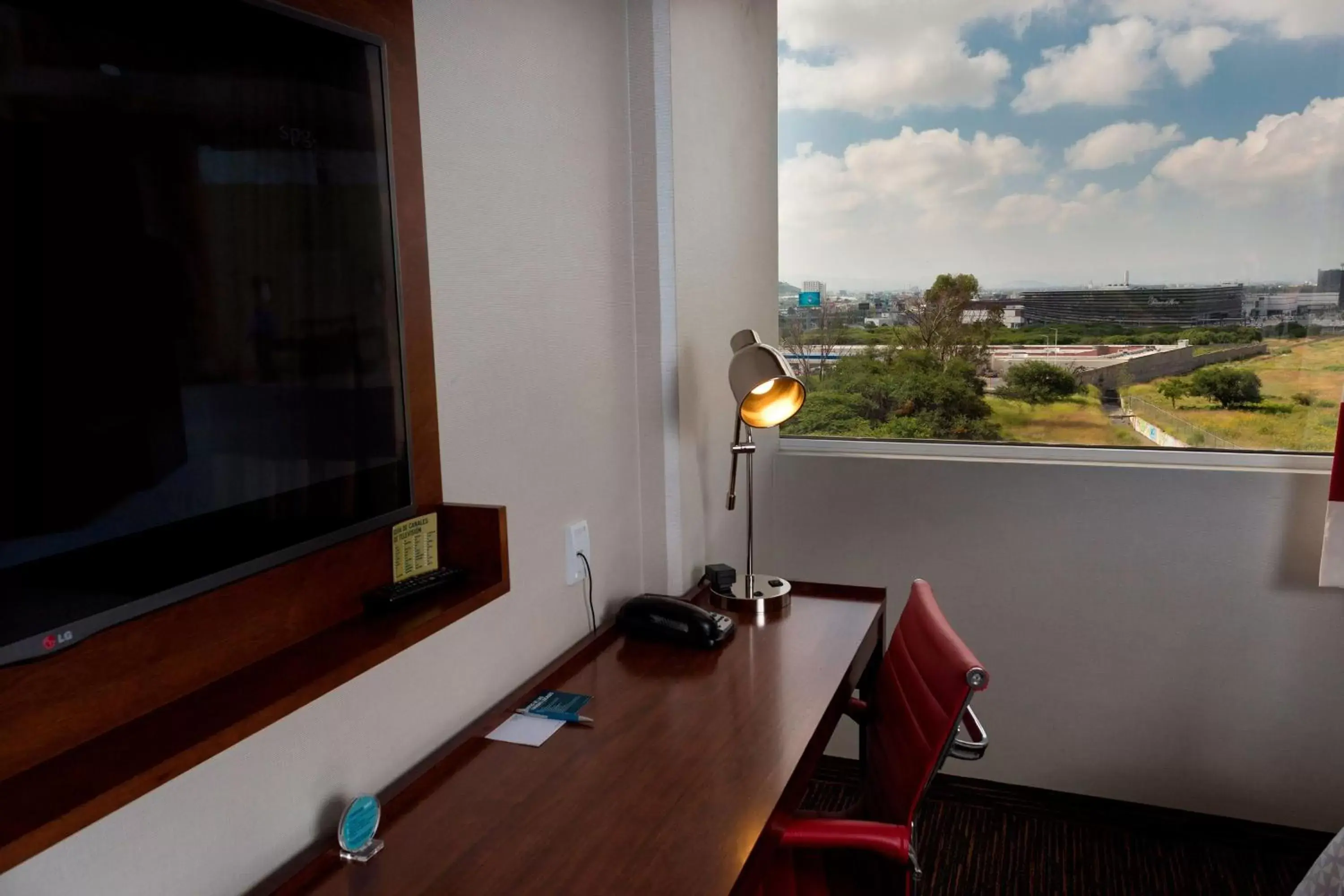 Photo of the whole room, TV/Entertainment Center in Four Points by Sheraton Queretaro Norte