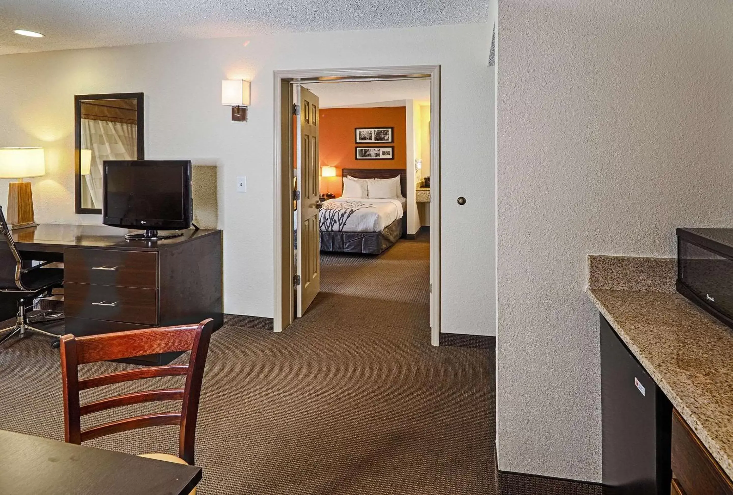 Bedroom, TV/Entertainment Center in Sleep Inn & Suites Spring Lake - Fayetteville Near Fort Liberty